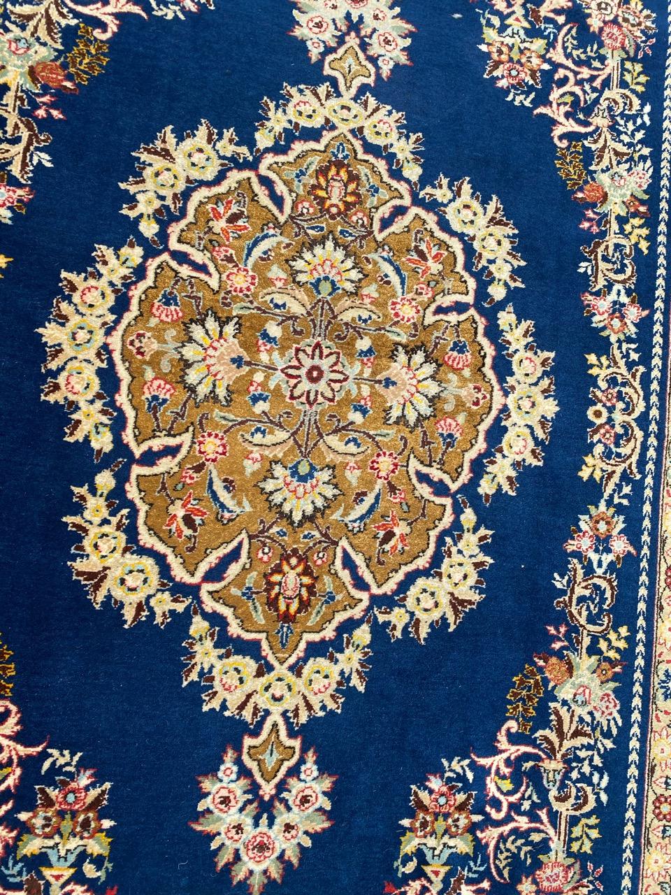 Very beautiful vintage rug with beautiful floral design and nice colors, entirely and finely hand knotted with wool and silk velvet on cotton foundation.