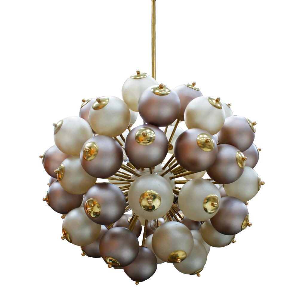 A spectacular and beautiful Sputnik Italian chandelier. composed of solid brass structure and rods and Murano glass lampshades in two different matte colors. It contains 10 light points that comes from brass rods. 

Dimentions: Diameter 95 cm x