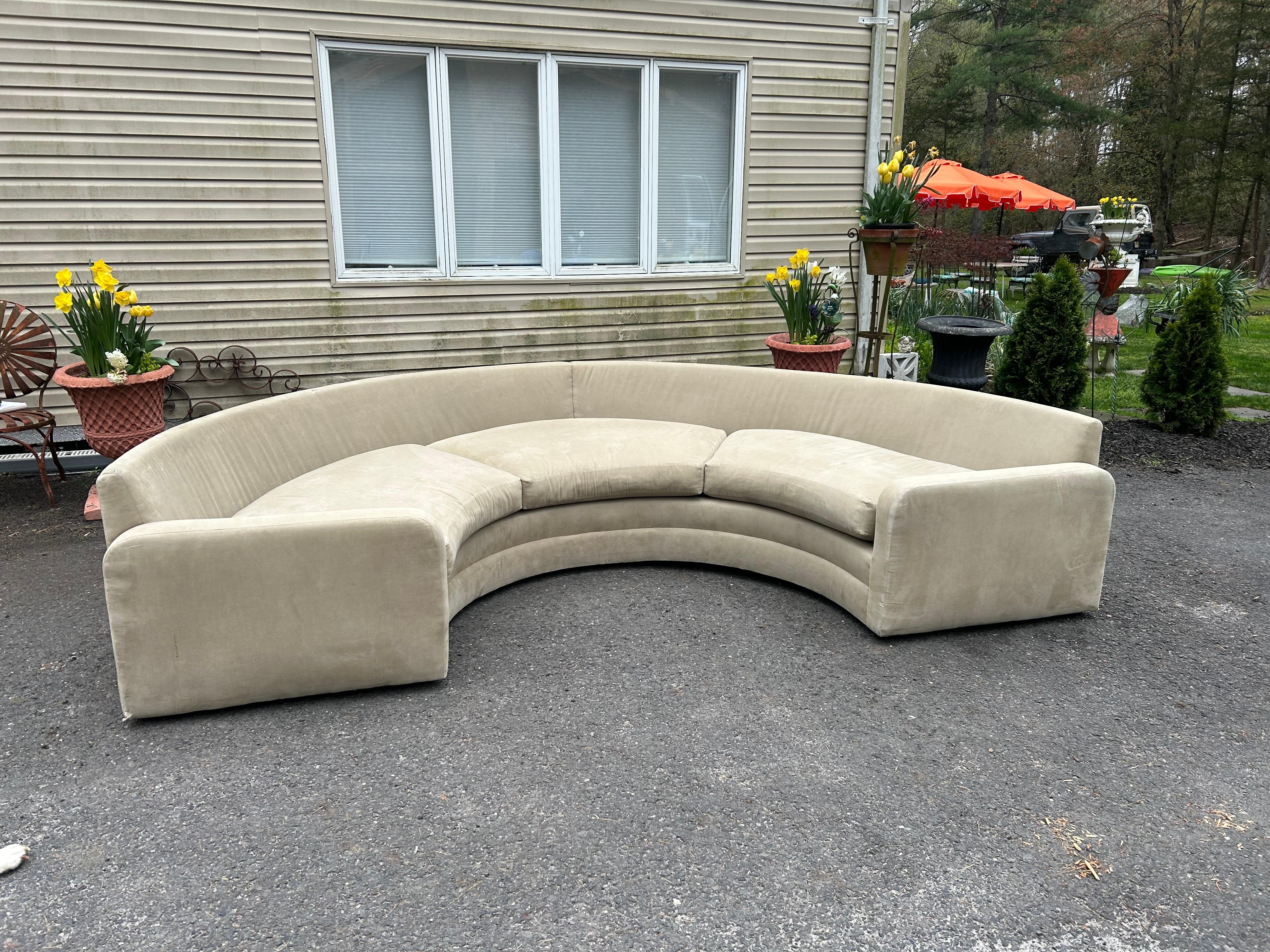 Wonderful Milo Baughman for Thayer Coggin semi-circular sofa.  This piece will certainly need to be reupholstered but Oh the possibilities!  This is a one piece sofa so it is a whopper but it is on casters so it moves around easily.  This particular