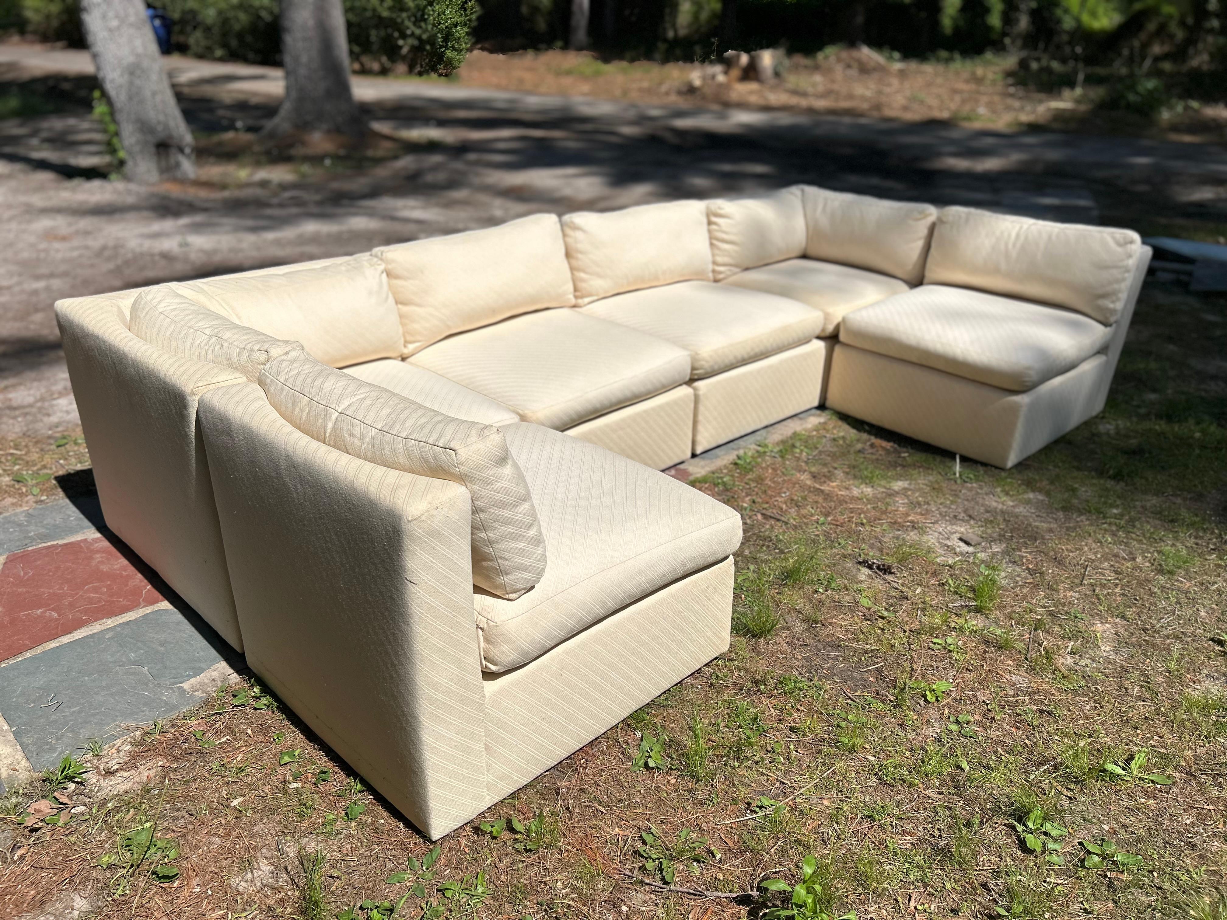 Unusual curved back 6-piece cube sectional sofa by Milo Baughman. We have had many many cube sofas by Mr. Baughman but we have never seen this design with the curved back. The original upholstery is still in good shape but will need a good cleaning.