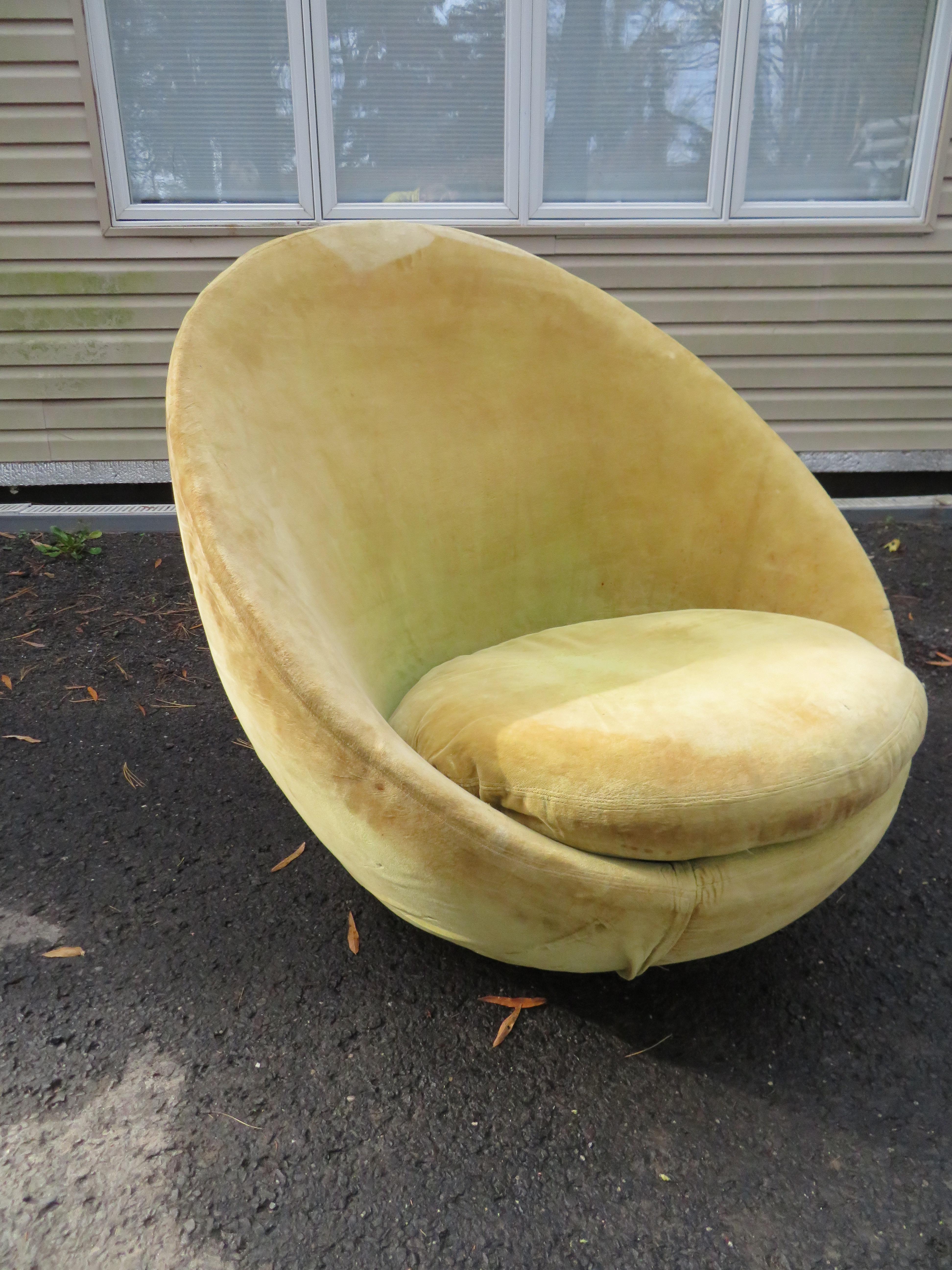 Wonderful large scale rocking, swivel egg chair designed by Milo Baughman for Thayer Coggin. Original velvet upholstery will need to be replaced but that's what you designers are looking for anyway-right?.