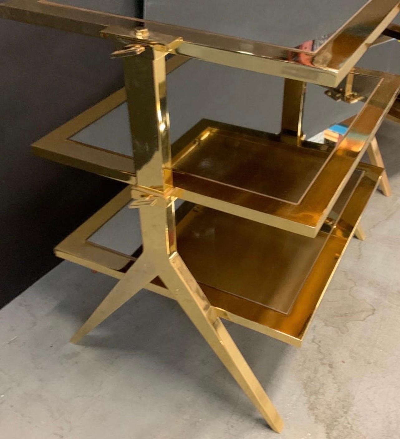 A wonderful modern Lorin Marsh polished brass and mirror inset three-tier side table

Measurements:
28.5