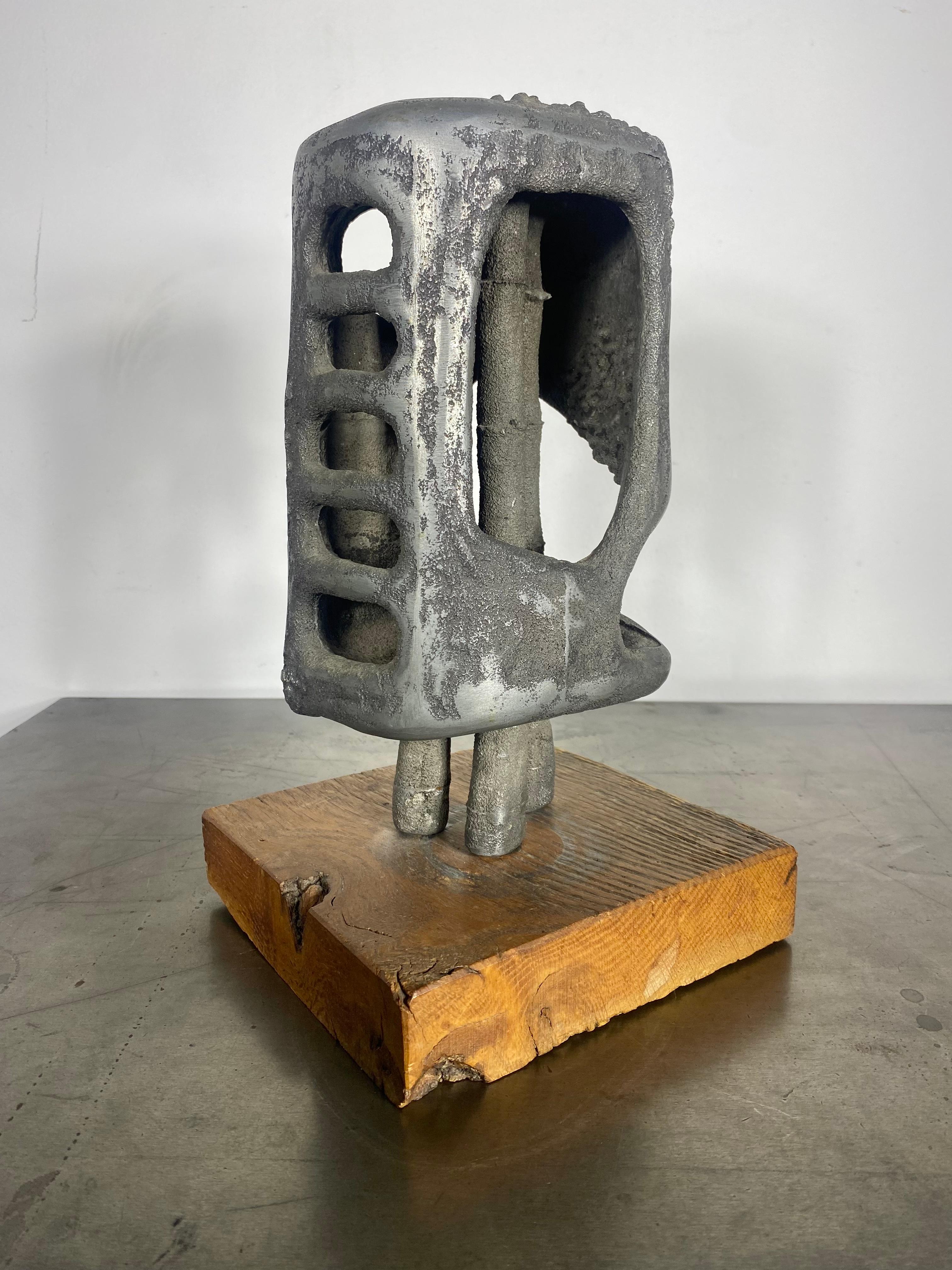 American mid-20th century modernist Brutalist abstract bust sculpture in cast and hand worked granulated and polished metal aluminum by award winning and well exhibited artist painter metal sculptor William F. Sellers ( 1929 - 2019 ) a contemporary
