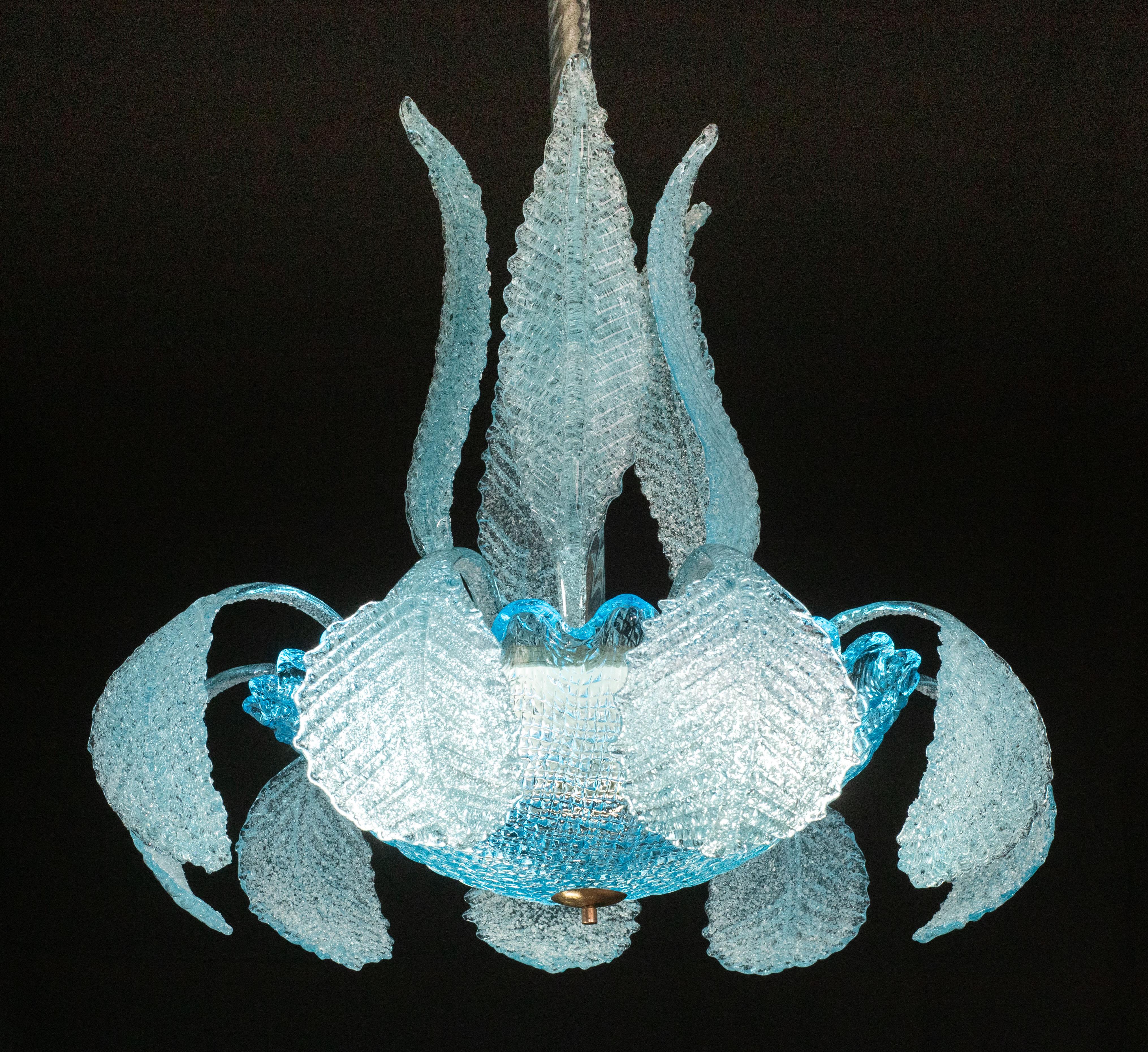 Wonderful Murano chandelier in rare Blue color by Barovier and Toso, 1940s.

A unique fine piece for any important space.

5 tall foliage, 9 low leaves and a beautiful central blue glass bowl.

3 lights, possibility of wiring for USA.