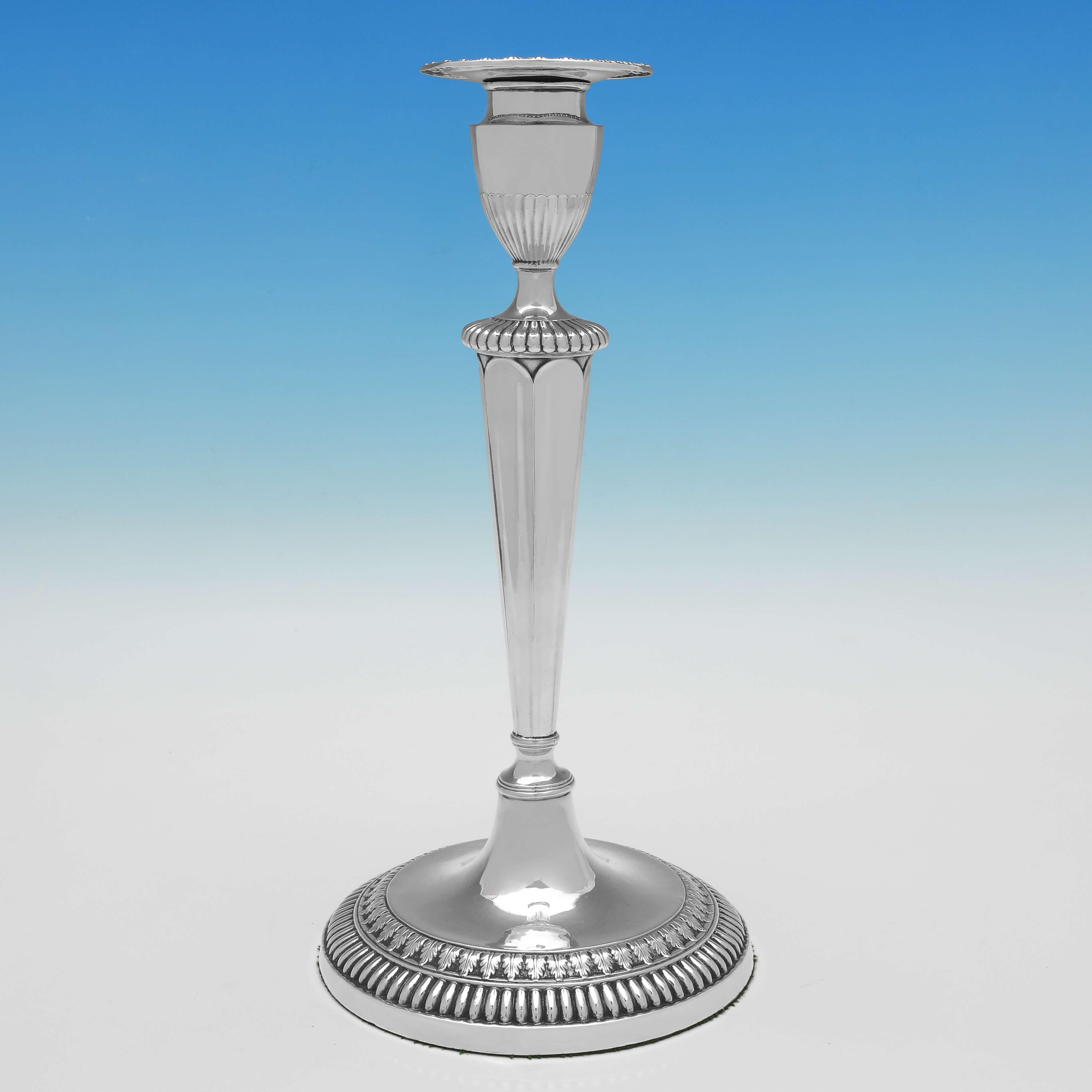 Made circa 1790, this charming set of 4 Antique Old Sheffield Plate Candlesticks, are in the Neoclassical taste, with bands of acanthus leaf and fluted decoration to the bases, fluting to the capitals, and removable nozzles with acanthus detailed