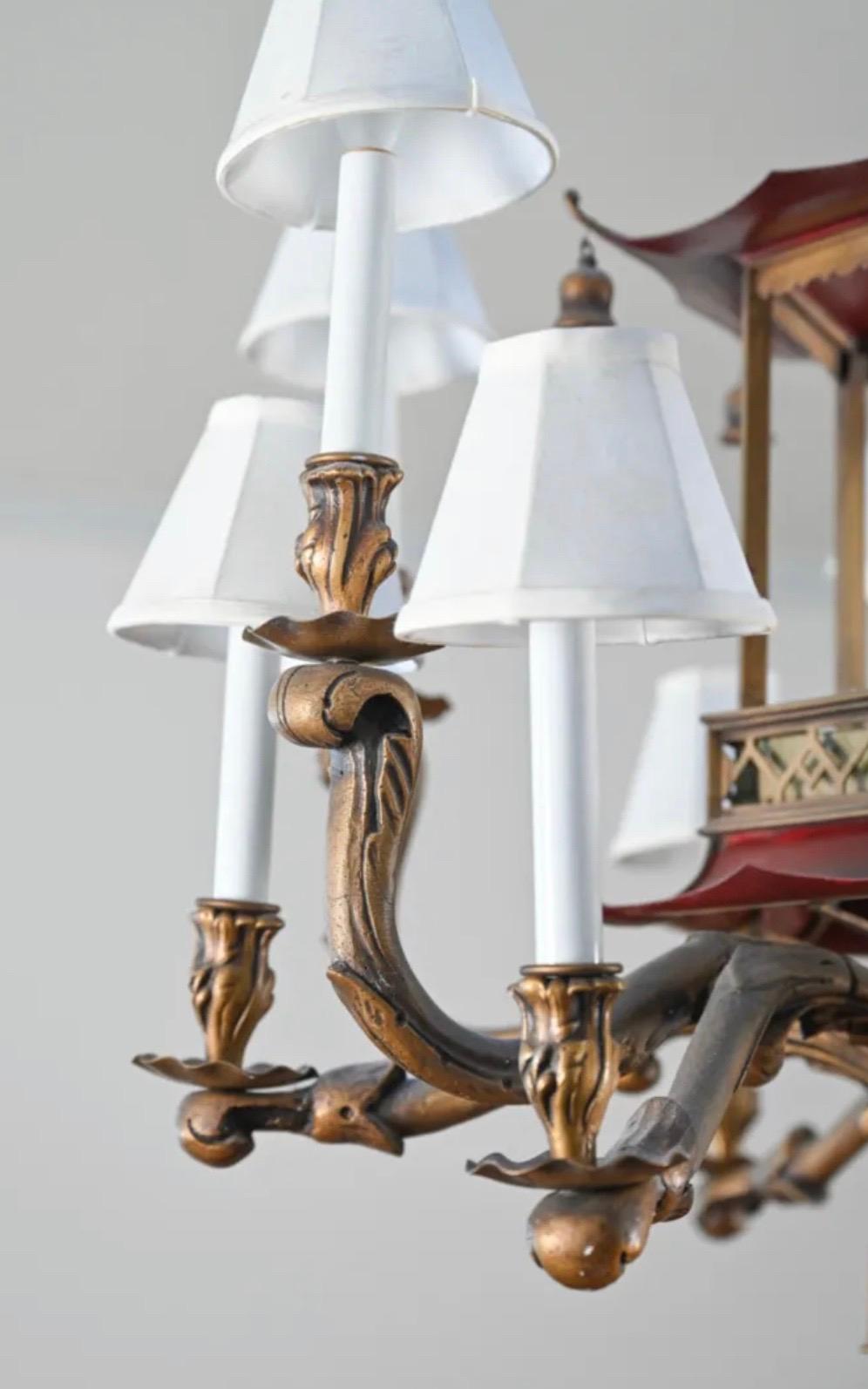 Wonderful pagoda tole red & gold painted 12 lights chandelier in Chinese Chippendale style. Dimensions: Height 33