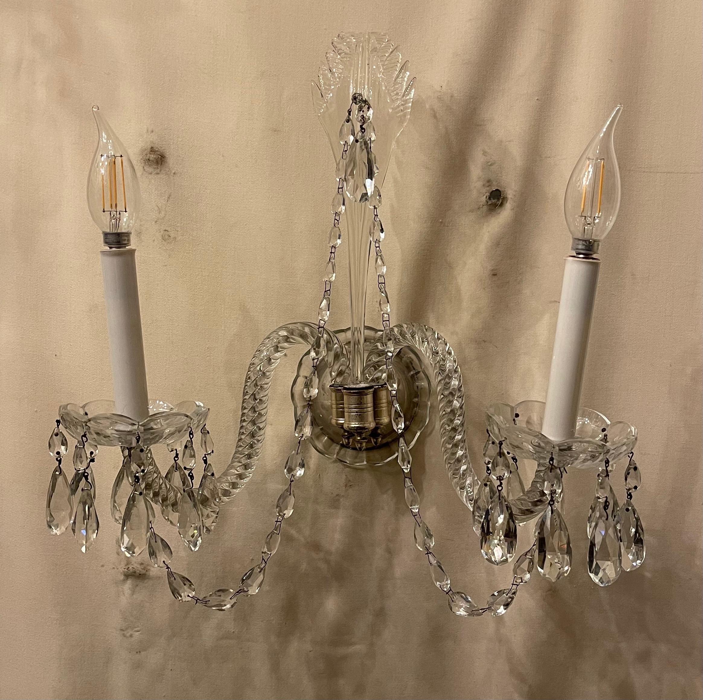 A wonderful pair of antique cut crystal Georgian style silvered bronze two light sconces with center palm leave cascading over crystal swags, the sconces are rewired and come with mounting brackets ready to install.