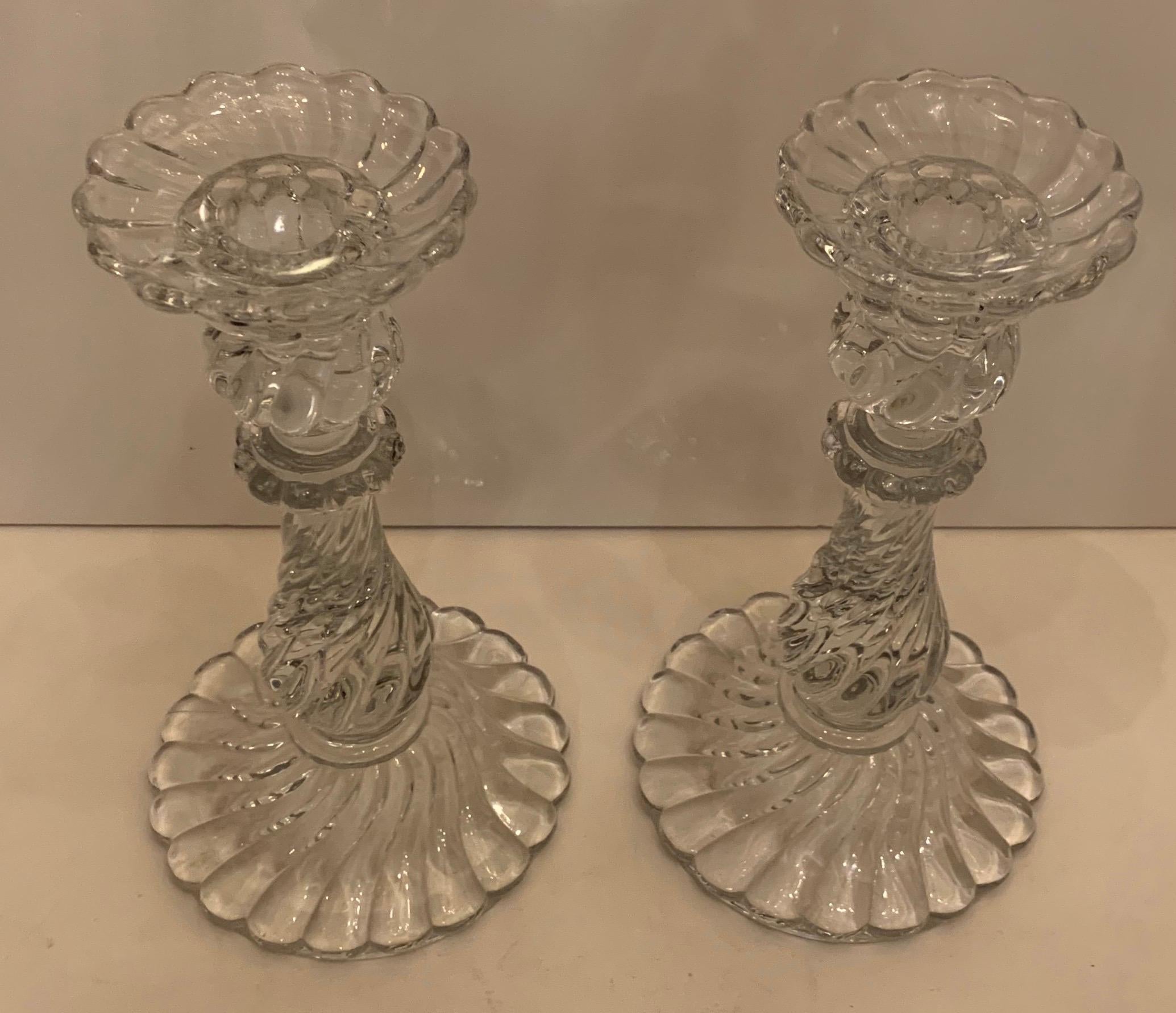 A wonderful pair of Baccarat glass candlesticks in the decorative swirl Bambous pattern.
Acid etched on the bottom with the Baccarat mark.