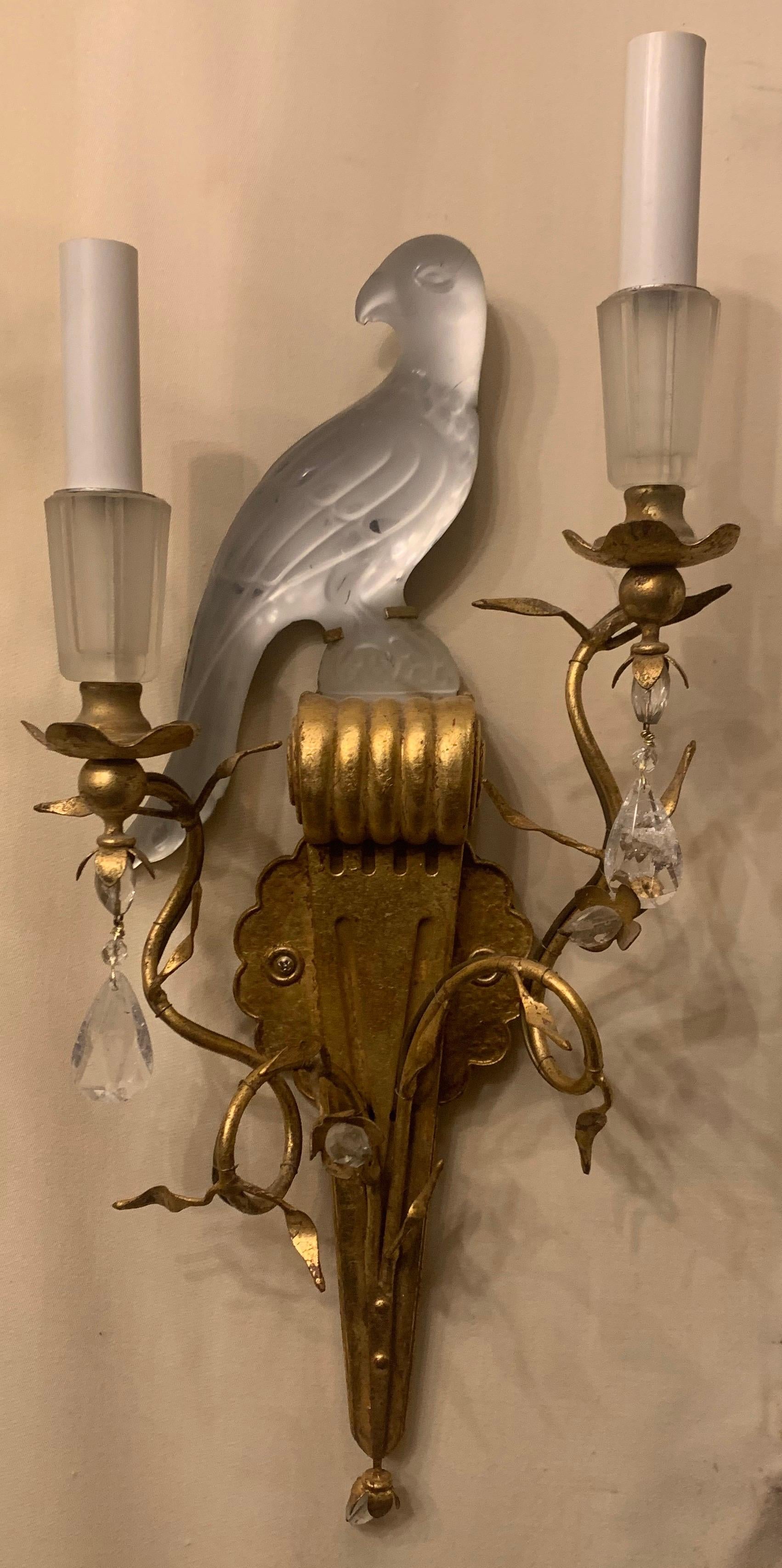 A wonderful pair of Baguès style Sherle Wagner two-arm gold gilt rock crystal drop and crystal bird urn and leaf form sconces.


 
 