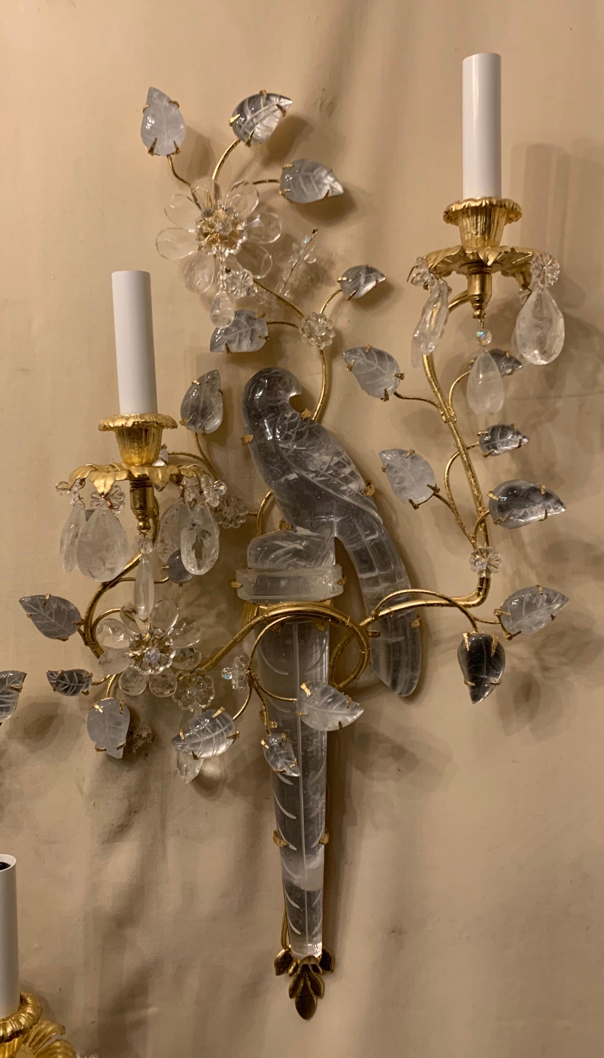 A wonderful pair of Baguès style two-arm with rewired candelabra sockets, rock crystal bird, flower, leaf, urn form large sconces.