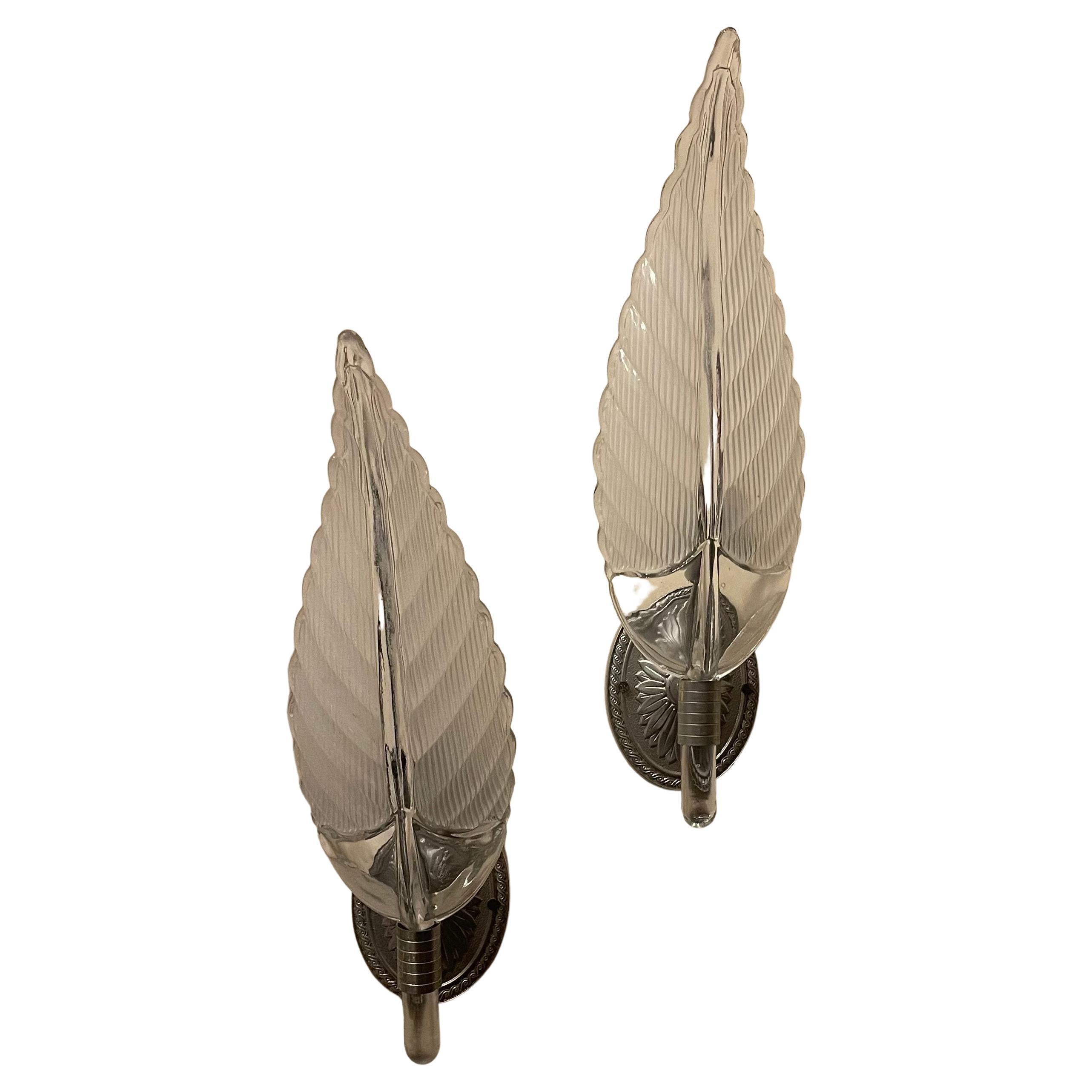 A Wonderful Pair Of Mid Century Modern Murano Sconces In The Manner Of  Barovier & Toso. With A Stunning Glass Shade In The Form Of A Large Leaf Shape And Having An Oval Nickel Plated Back Plate Leading To A Single Candelabra Socket. 