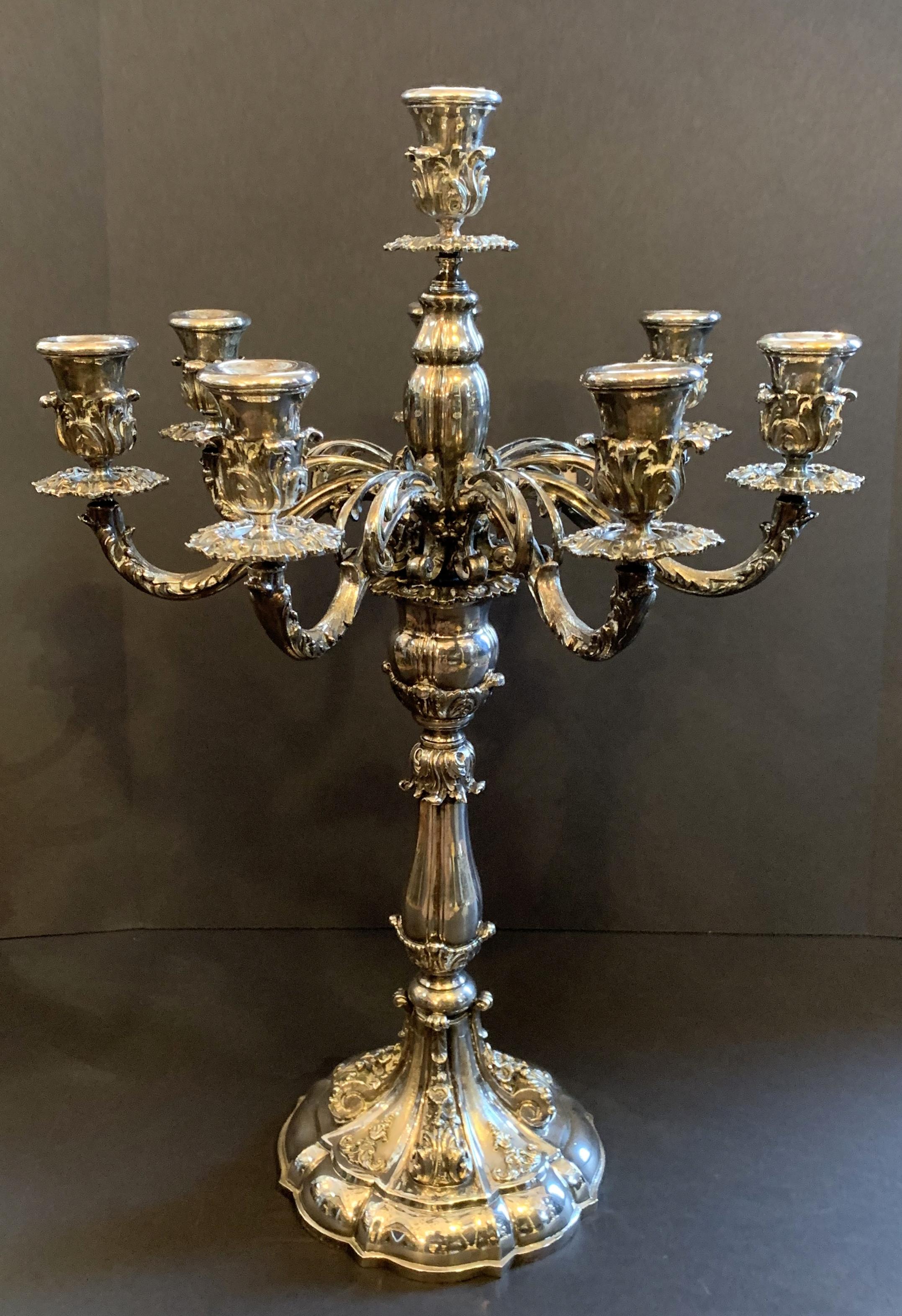 A wonderful pair of stamped Braganti Italy sterling silver plated heavy monumental 7-arm candelabra.