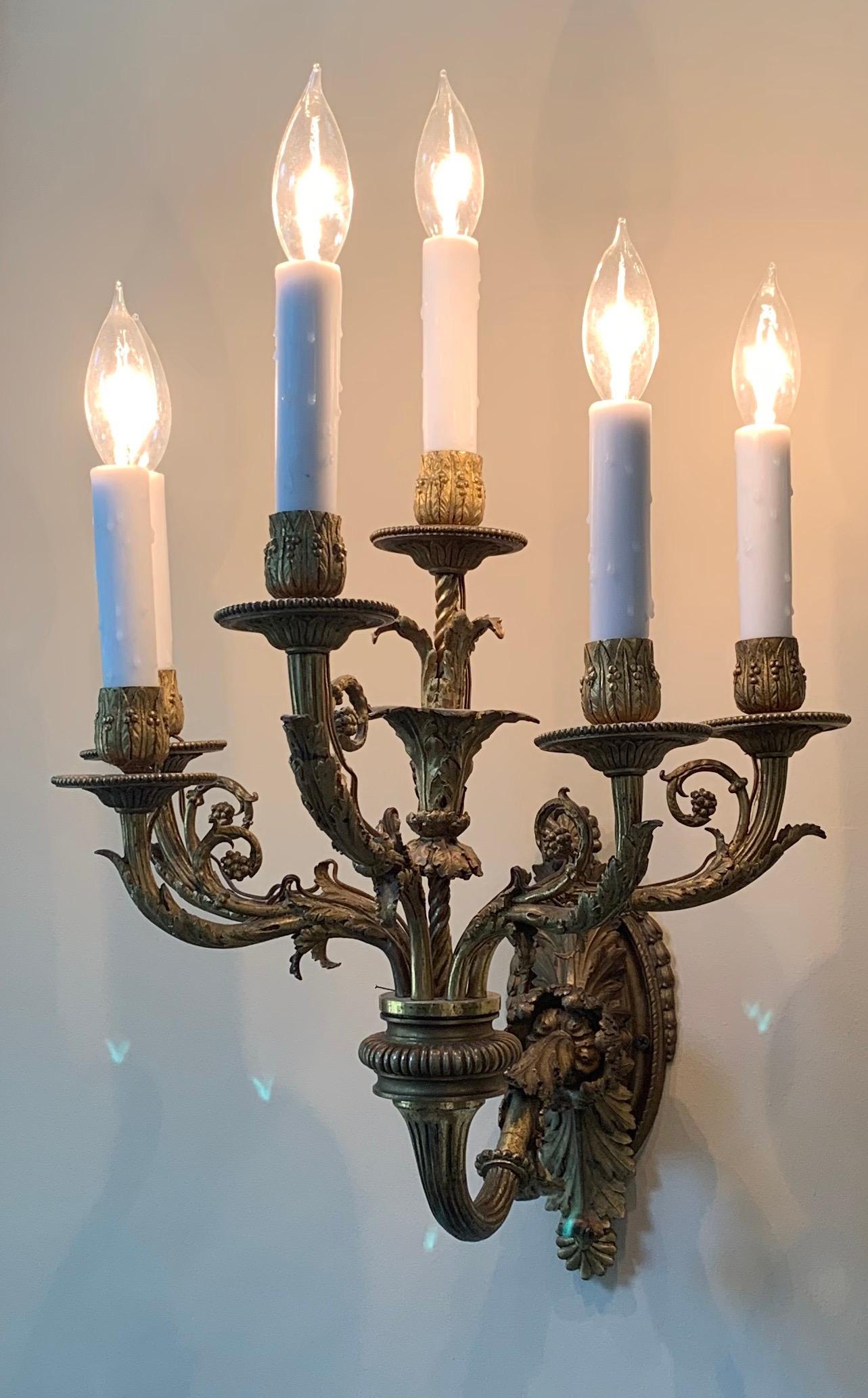 A wonderful pair of Caldwell style French Dore bronze neoclassical / Empire / Regency 6 candelabra light sconces.