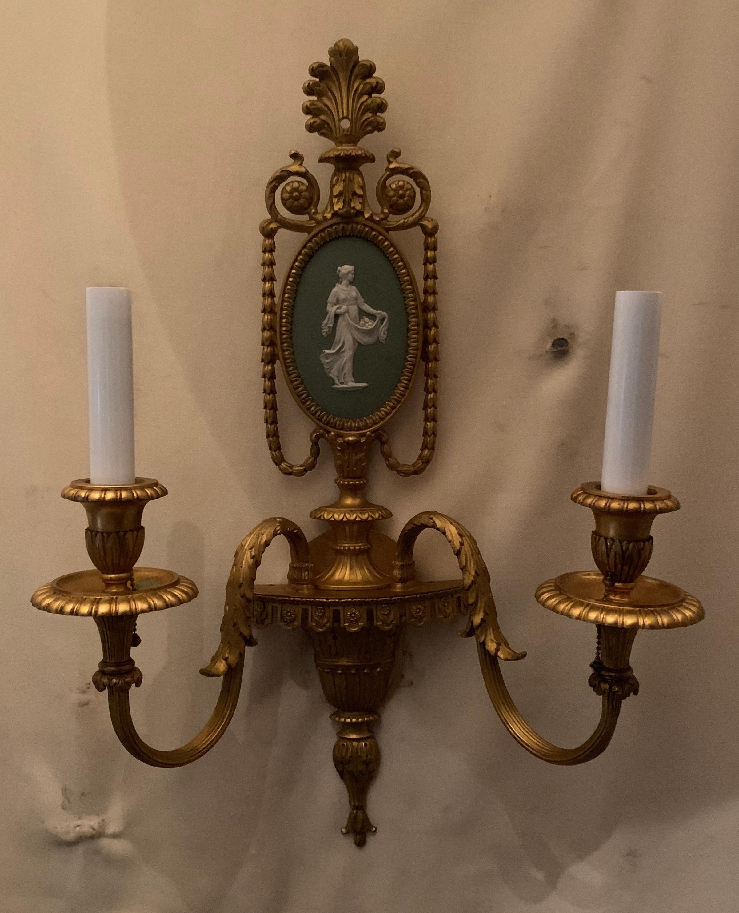A wonderful pair of Caldwell light green Wedgwood plaque and doré bronze ormolu neoclassical 2 candelabra pull chain sconces completely rewired with original sockets intact ready to install and enjoy.
