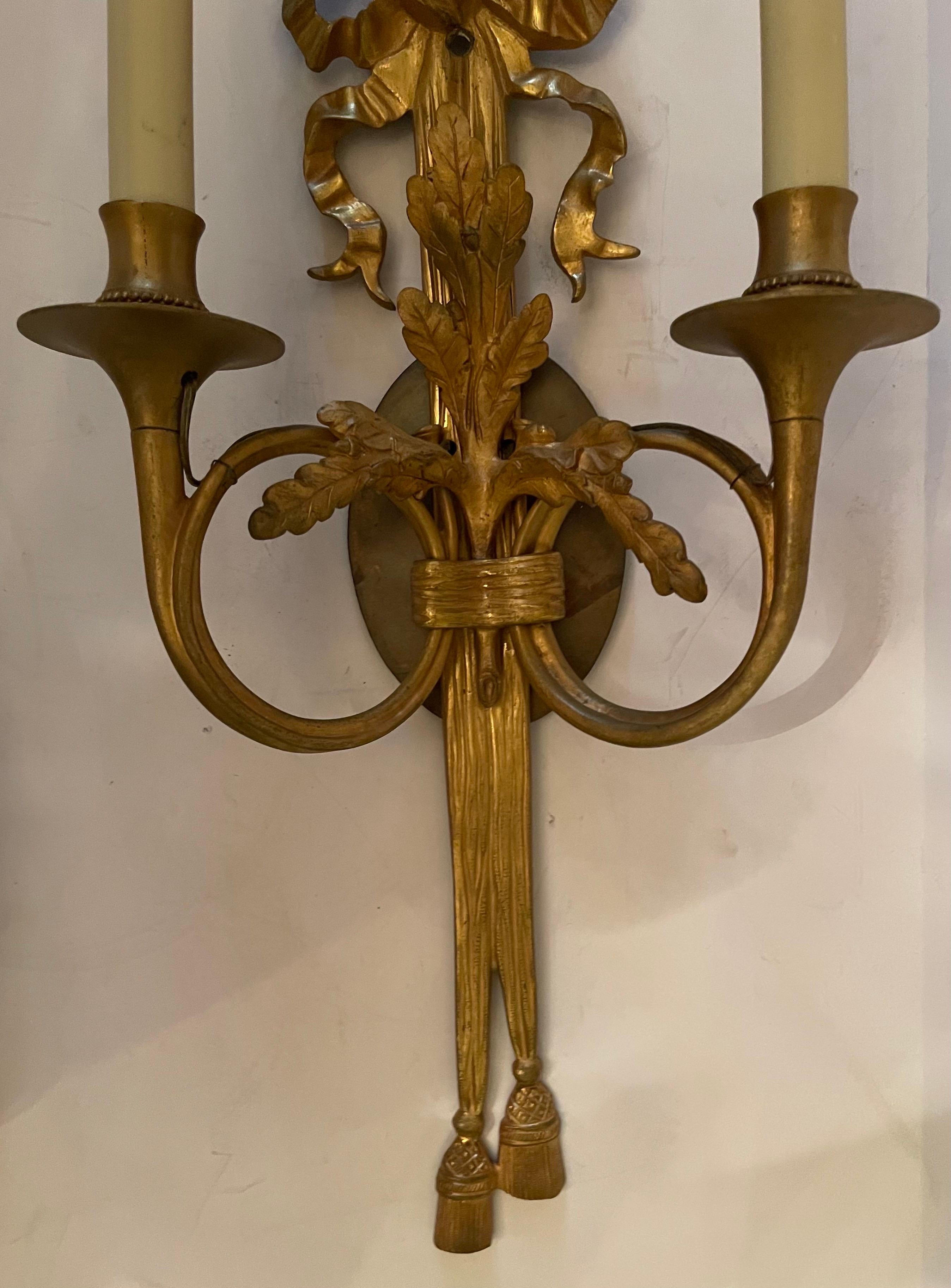 Wonderful Pair Dore Bronze French Horn Flute Bow Top Tassel Caldwell Sconces In Good Condition For Sale In Roslyn, NY