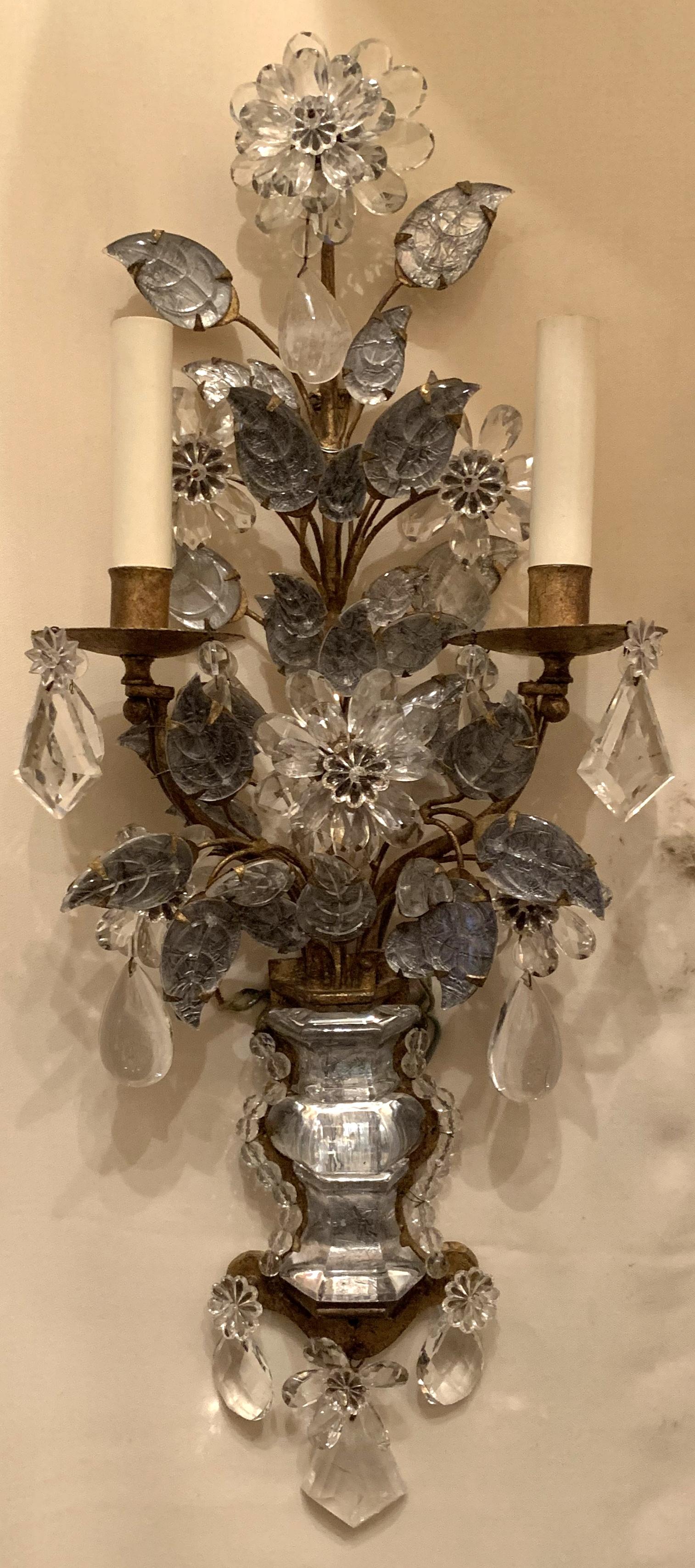 A wonderful pair of French Baguès rock and crystal gold gilt, flower / leaf / urn form vintage sconces purchased from The World Famous Lighting Store Nestles NYC with label still attached.