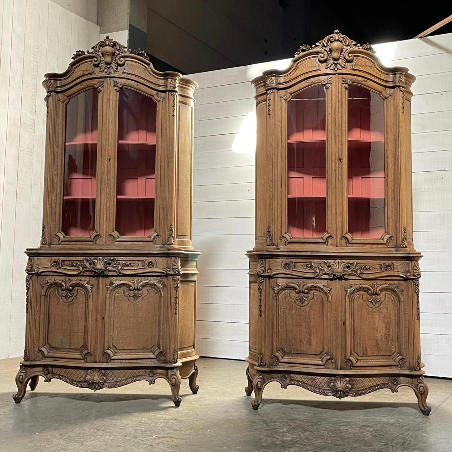 A very impressive and impossible to find pair of French Regence style bookcases or cabinets. These have come from a Chateau in the Loire region. Dating to the early 19th Century and made from oak. The fronts and sides are serpentine in form and each