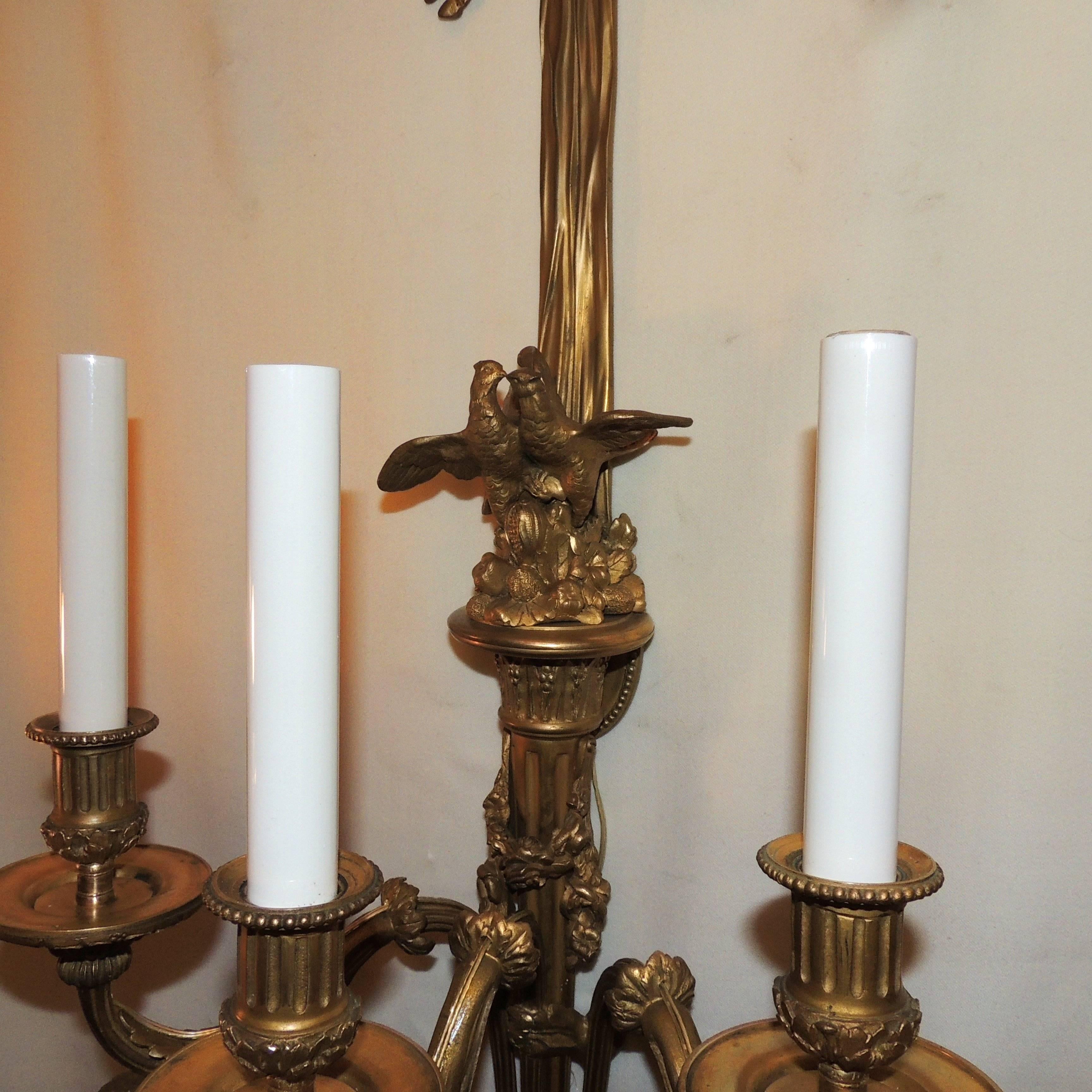 Wonderful Pair French Dore Bronze Bow Love Birds Tassel Swag Three-Arm Sconces In Good Condition For Sale In Roslyn, NY