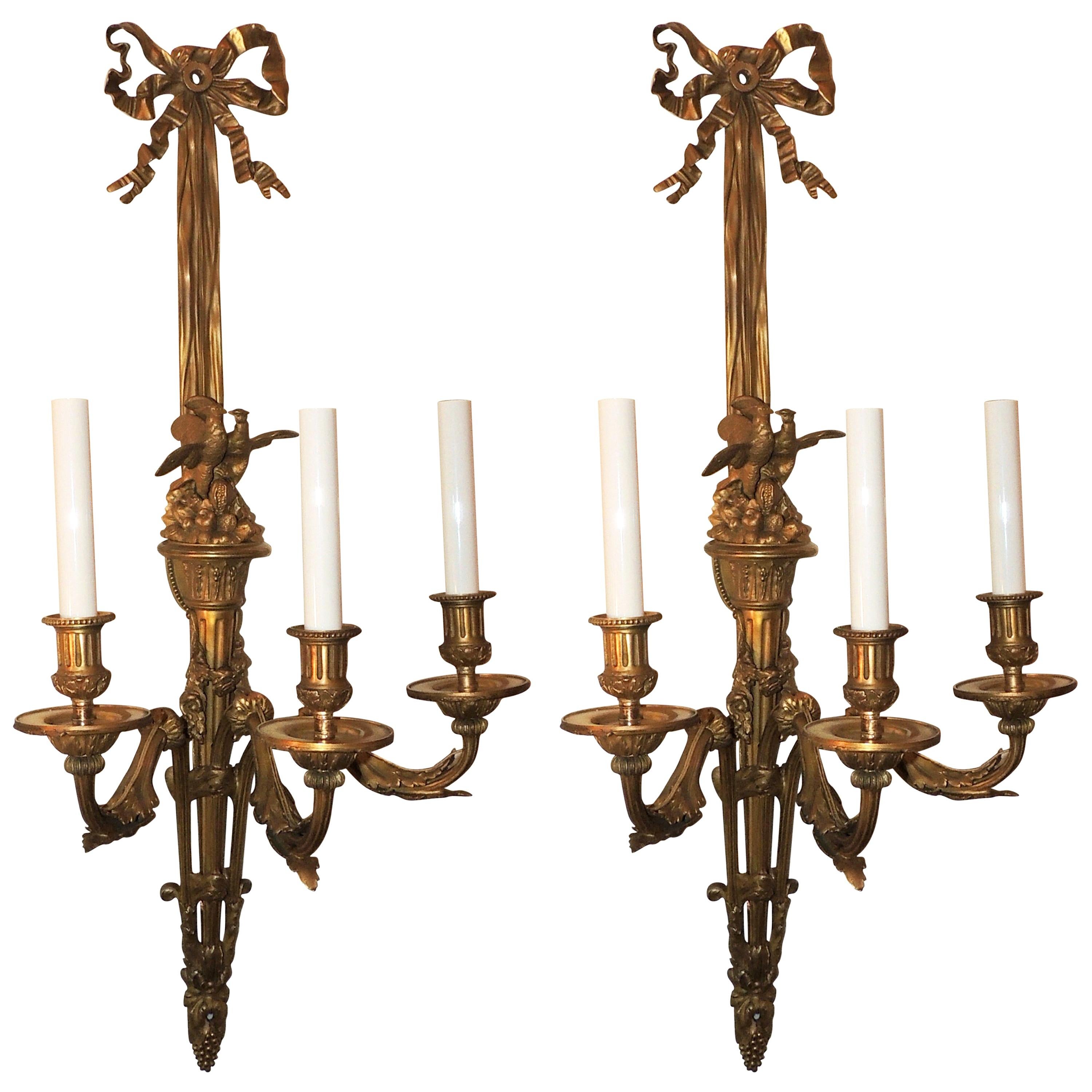 Wonderful Pair French Dore Bronze Bow Love Birds Tassel Swag Three-Arm Sconces For Sale