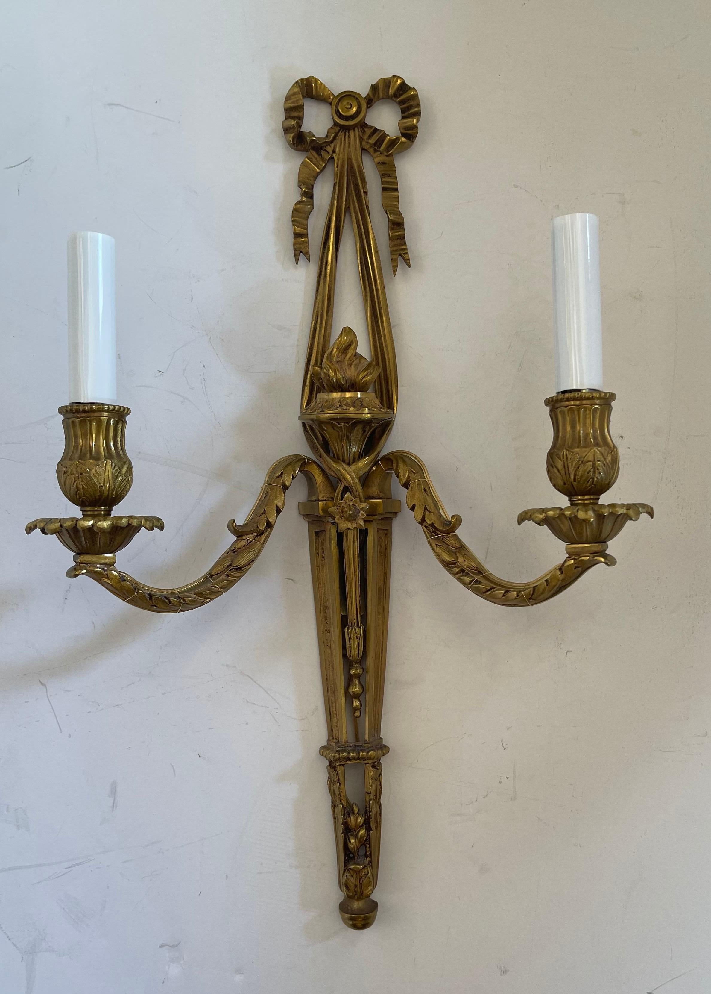 A Wonderful pair of French Dore bronze ribbon top, Torchiere neoclassical rewired two candelabra light sconces.