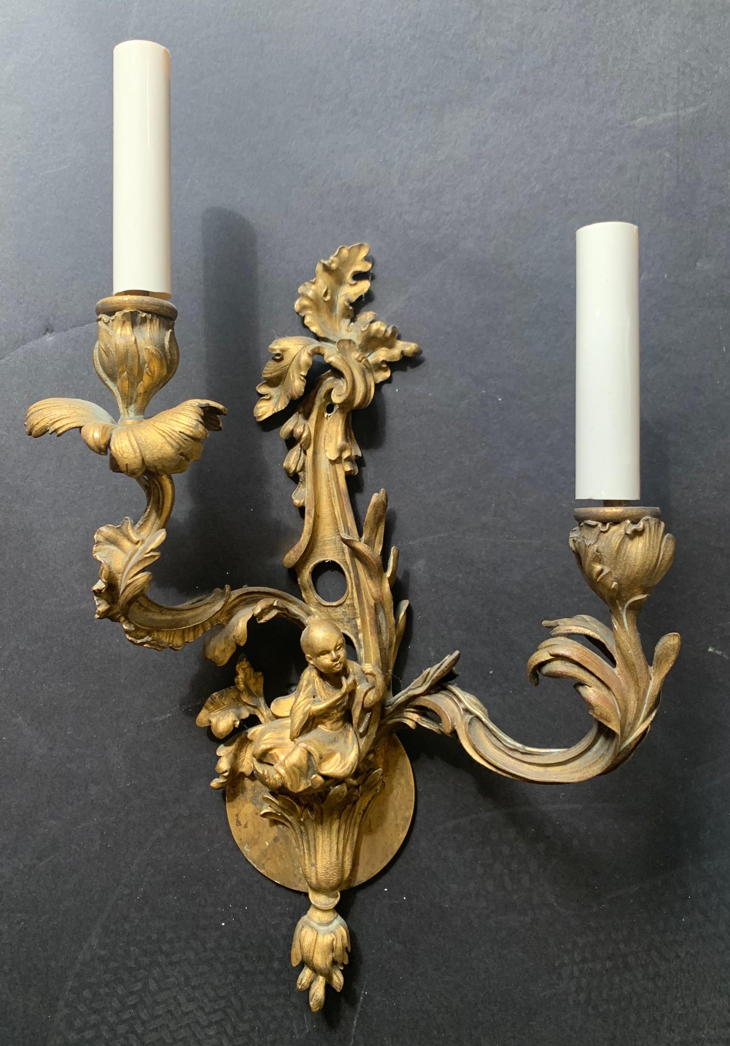 A wonderful pair of French doré bronze rococo figural chinoiserie 2 candelabra light wall sconces.