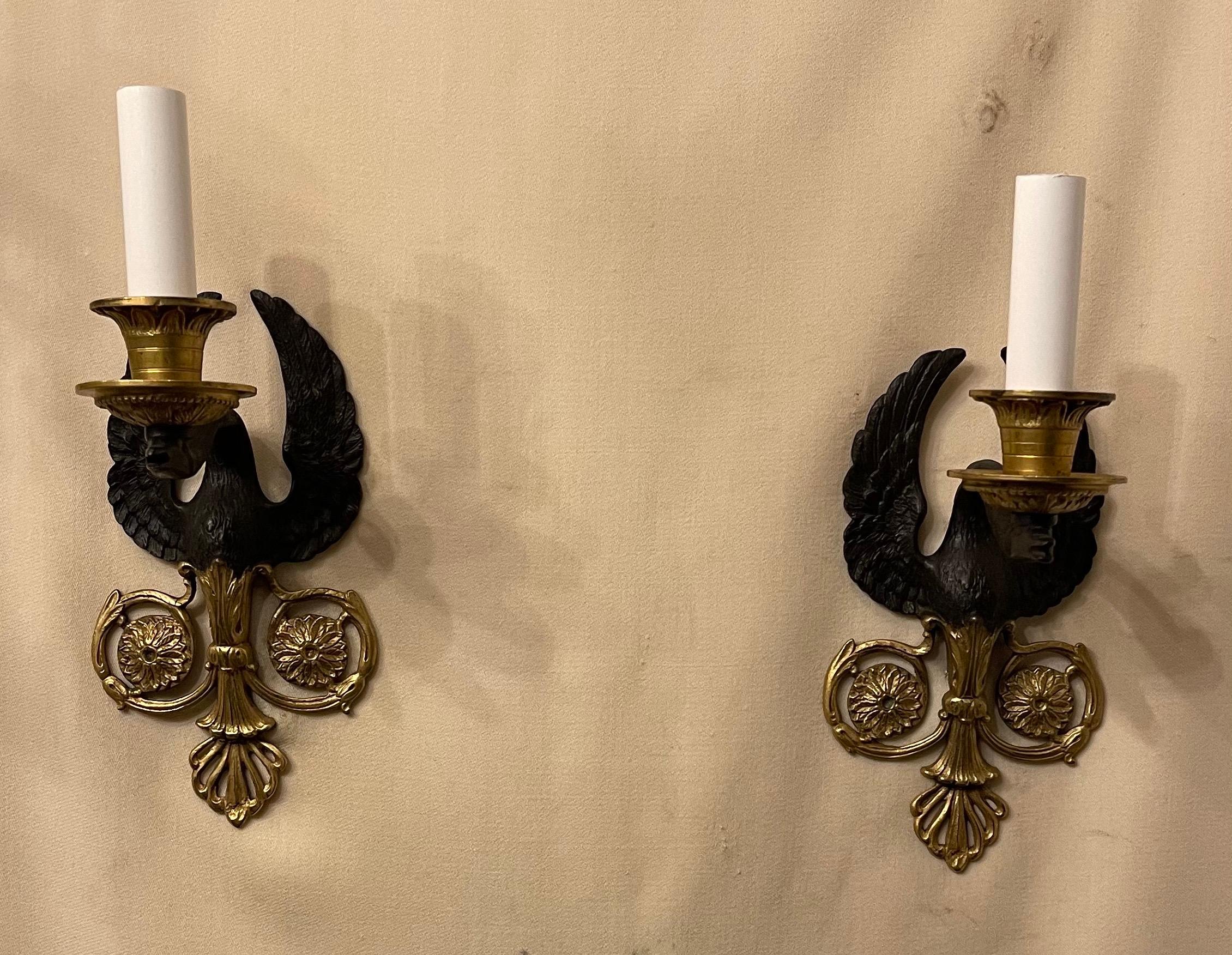 A wonderful pair French empire patinated dore bronze swan neoclassical sconces.