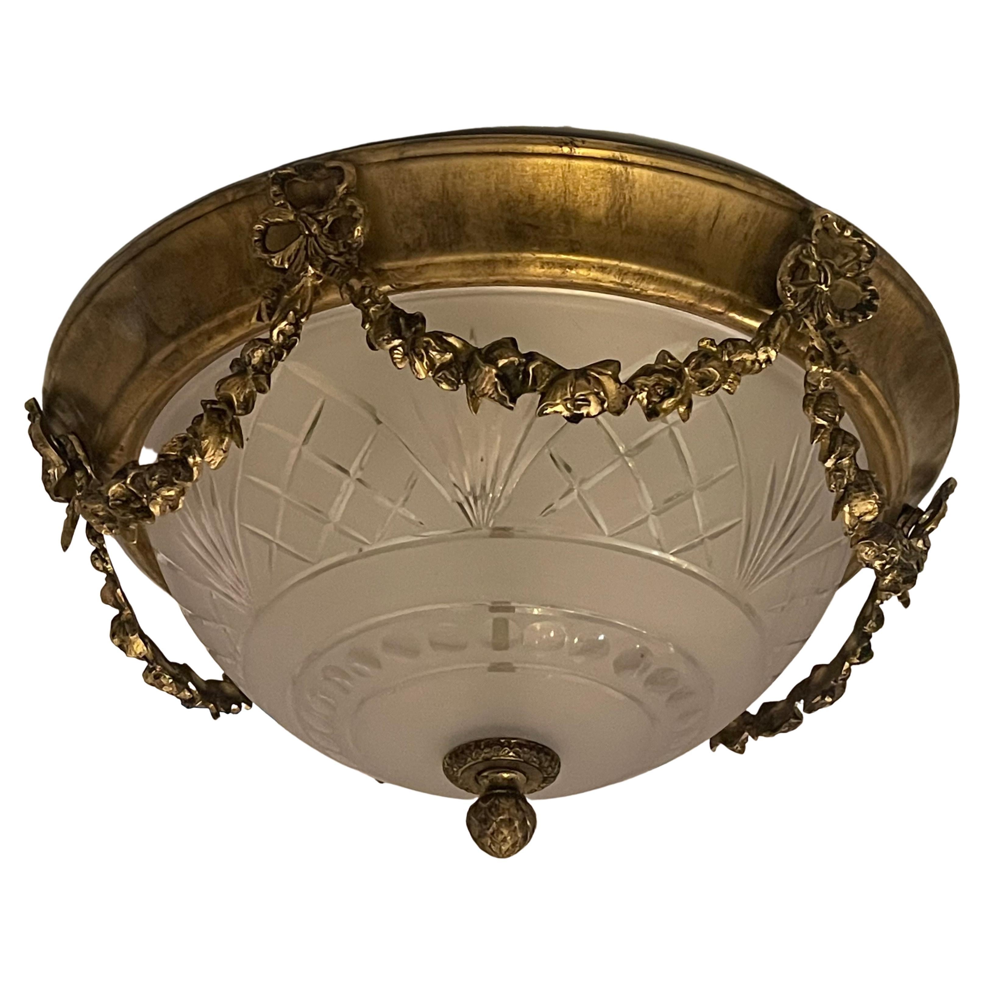 A wonderful pair of vintage French style gold gilt and etched frosted glass ormolu swag with bows and garlands flush mount ceiling fixtures, each with 2 candelabra sockets that are ready to install.