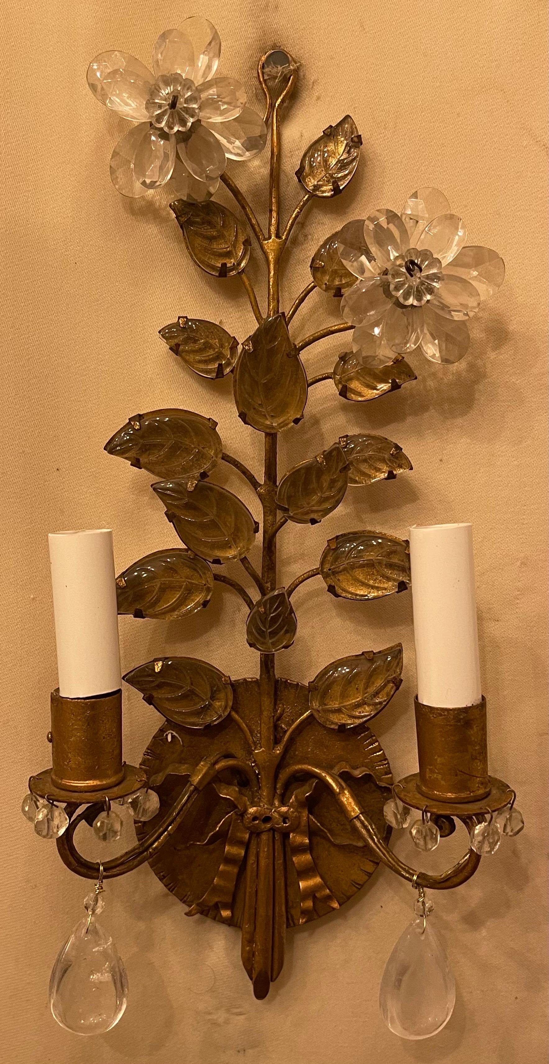 A Wonderful pair of French gold gilt with rock crystal drop and crystal leaf bouquet ribbon two candelabra light sconces in the manner of Baguès.
     