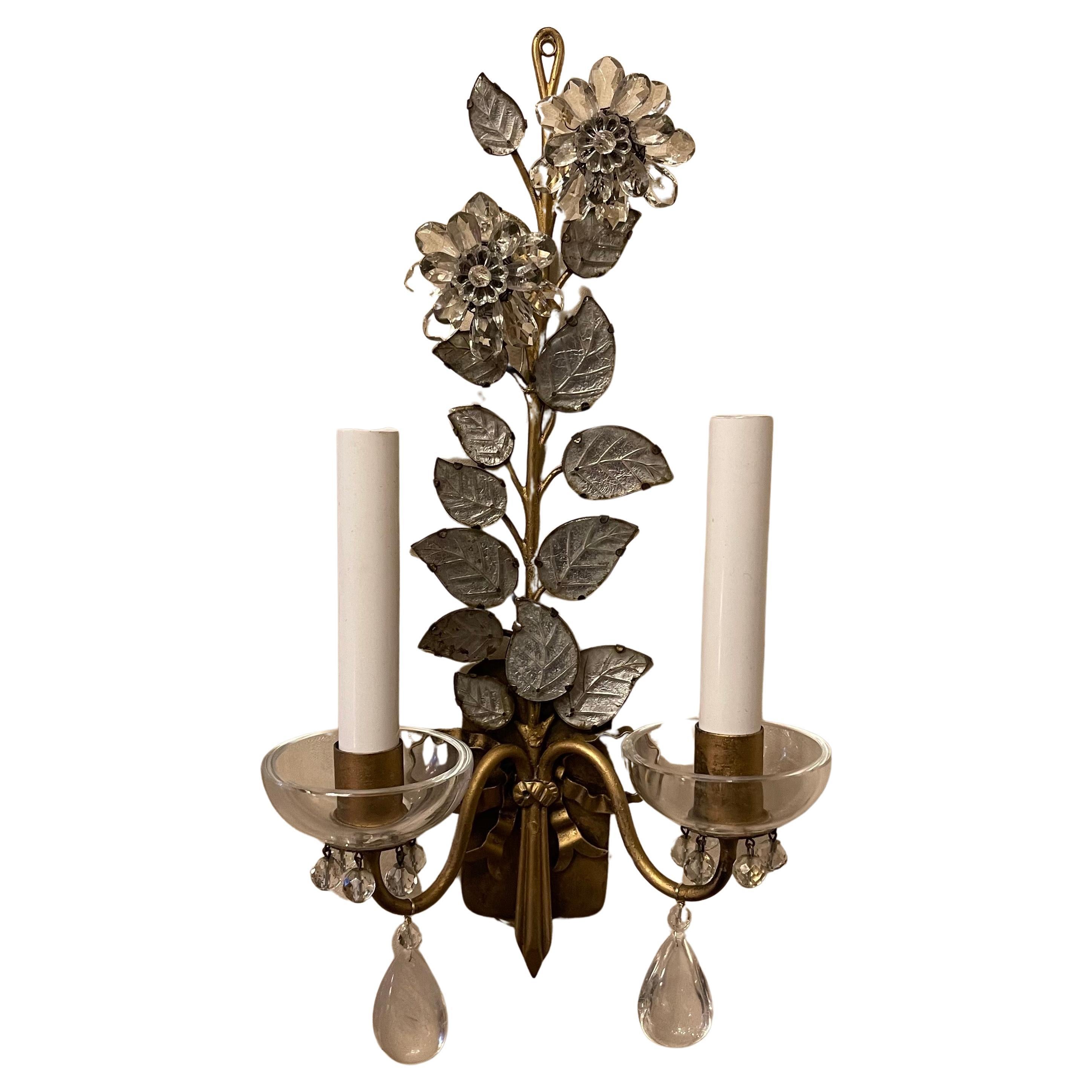 A wonderful set of four gold gilt rock crystal and crystal flower, leaf sconces having a large bow center medallion in the manner & Style of Bagues. 

2 pairs of sconces available
Each pair sold separately.