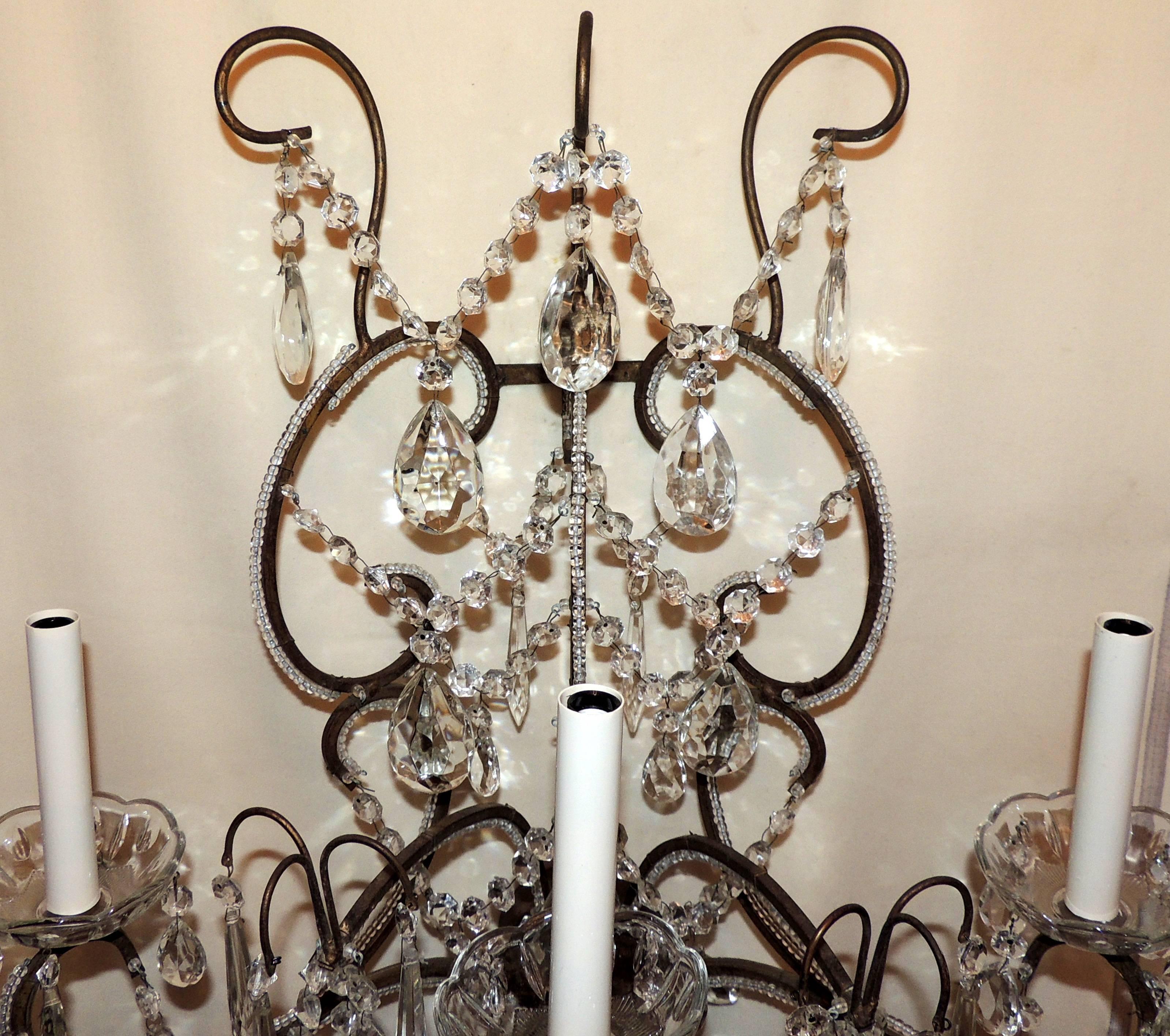 A wonderful pair of large beaded crystal swag Italian three-light wall sconces
Measures: Approximate 21 1/2