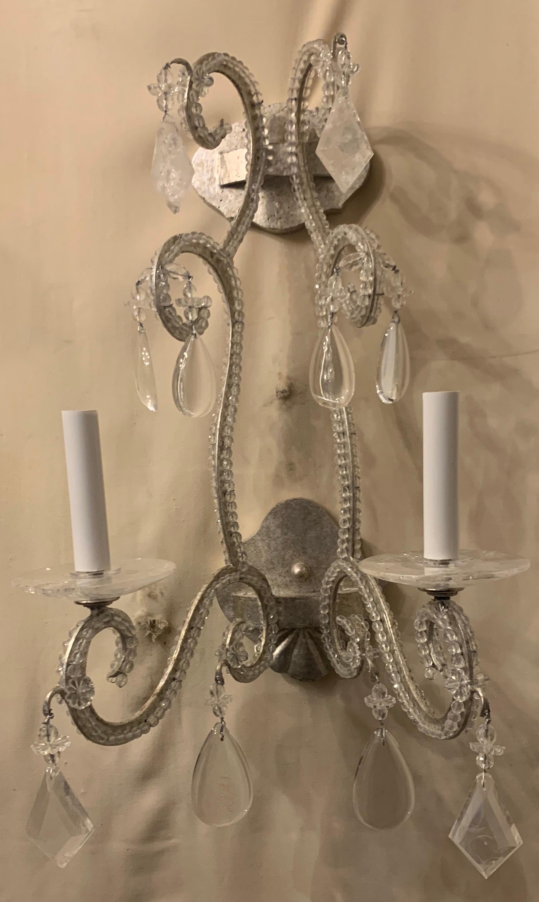 A wonderful pair of large silver gilt rock crystal and beaded modern transitional Baguès style sconces.