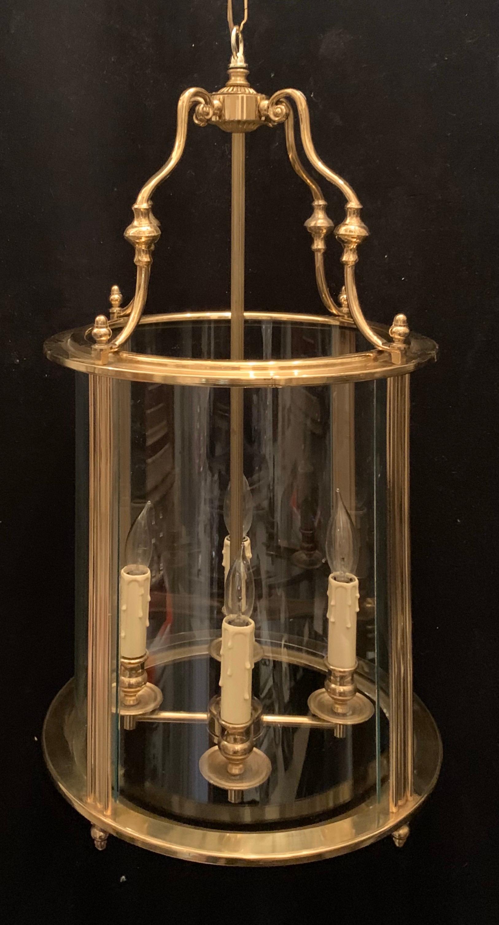 A wonderful Louis XVI / Georgian style brass & curved glass lantern circular light fixture pendent each with 4 candelabra lights.