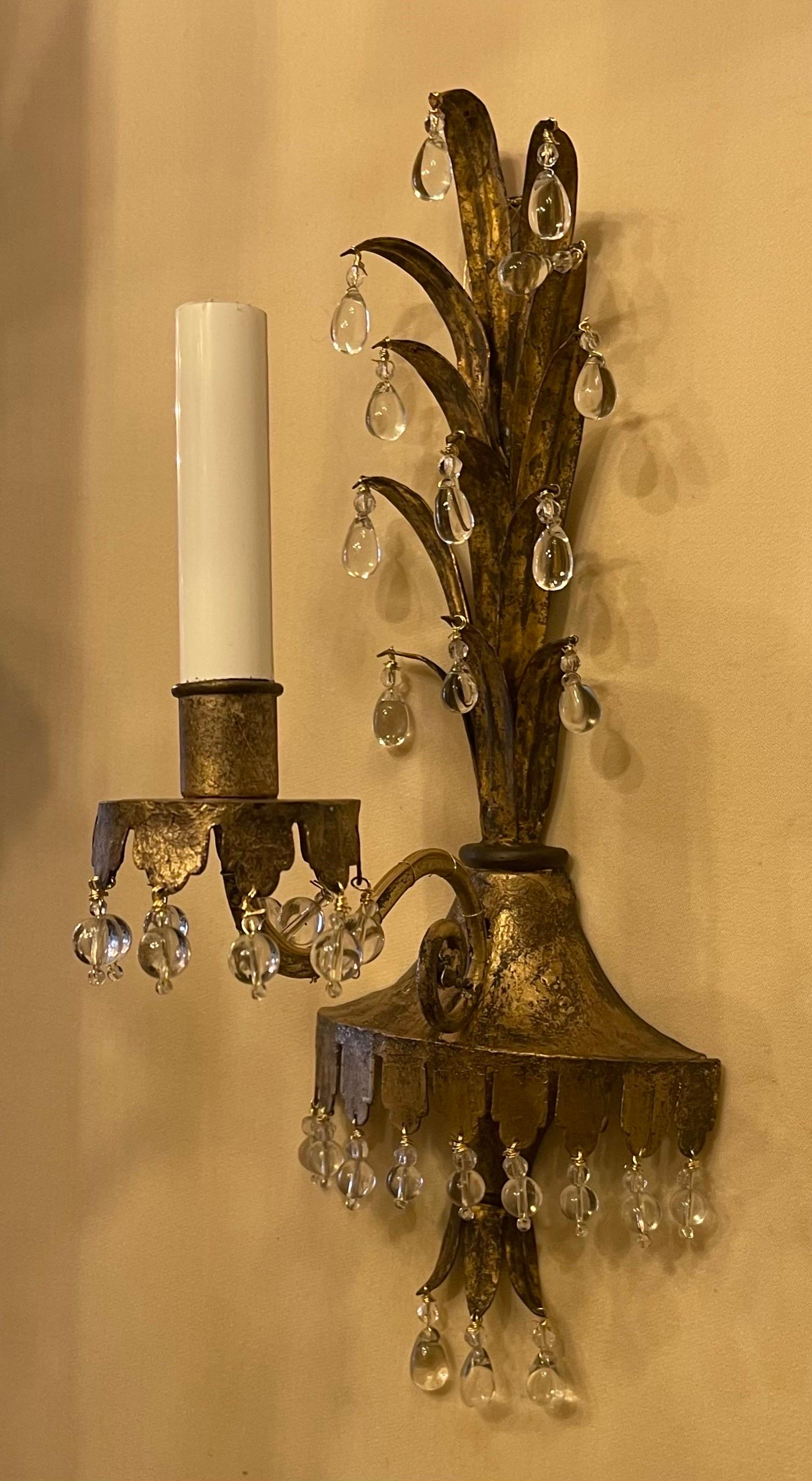 A wonderful pair of Maison Baguès style crystal tear drop & beaded gold gilt tole leaf spray form sconces, each rewired with new candelabra sockets.