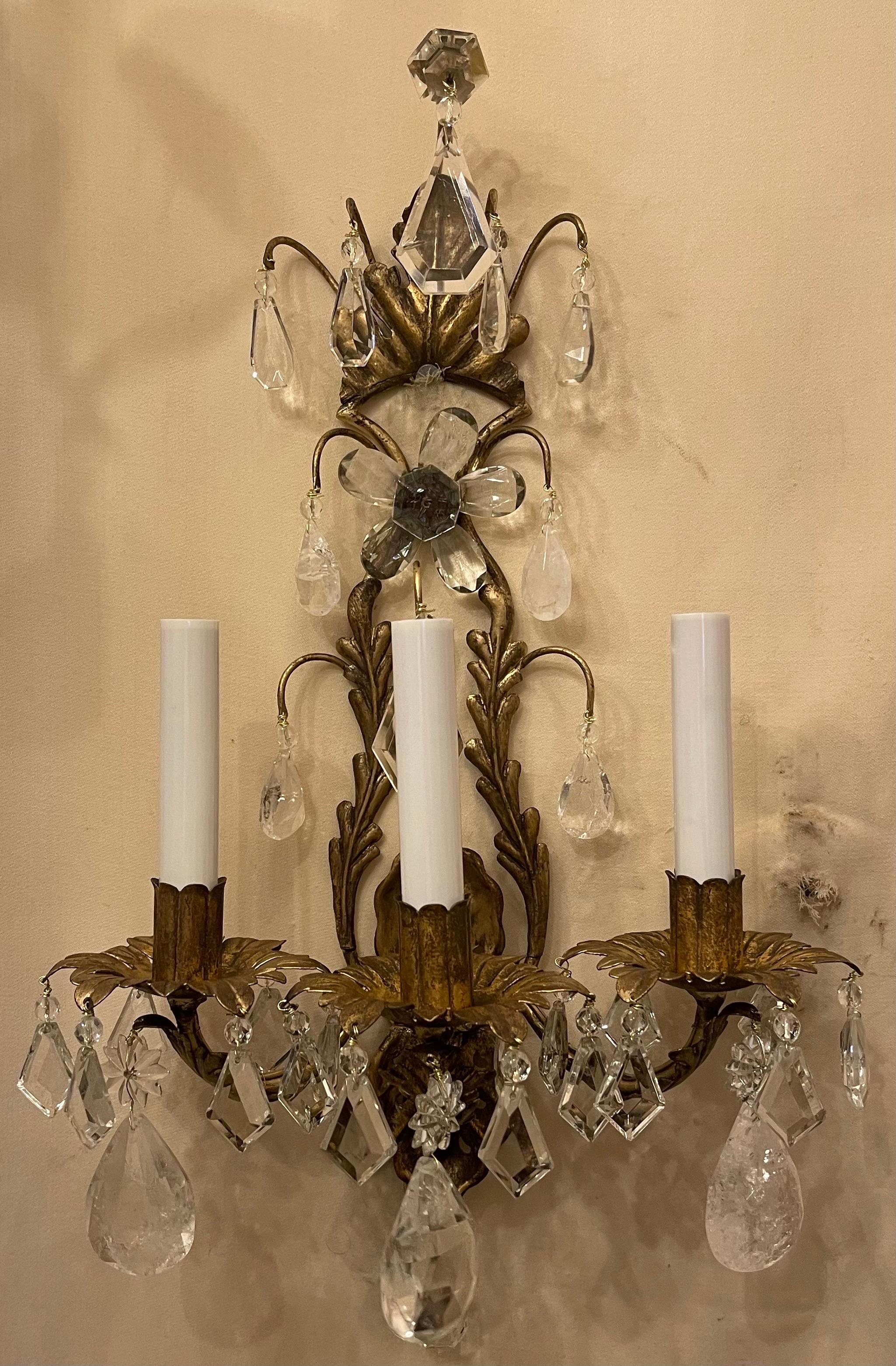 A wonderful vintage pair of Maison Baguès style rock crystal and gold gilt tole filigree three candelabra light sconces, completely rewired with new sockets.