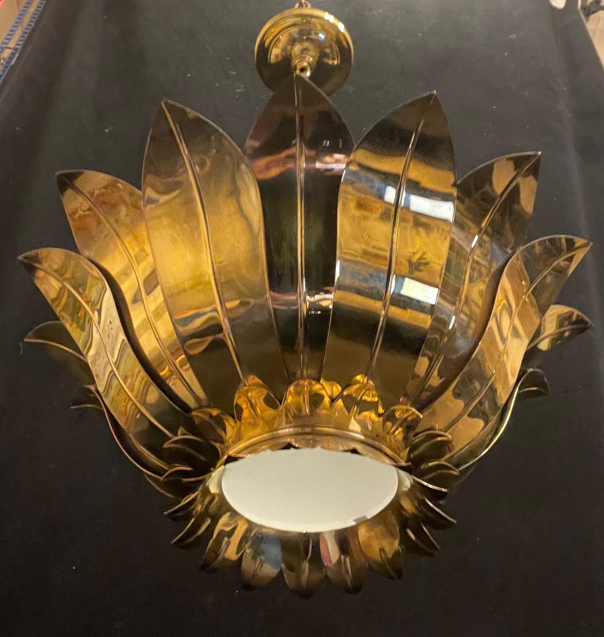 A Wonderful Pair Of Mid Century Modern Style Brass Sun Flower / Star Burst Leaf Form Light Fixtures, Each Fixture Had 3 Edison Lights With A Frosted Glass Center Bottom To Allow The Light Through.

Each Light Fixture Is Sold Individually 