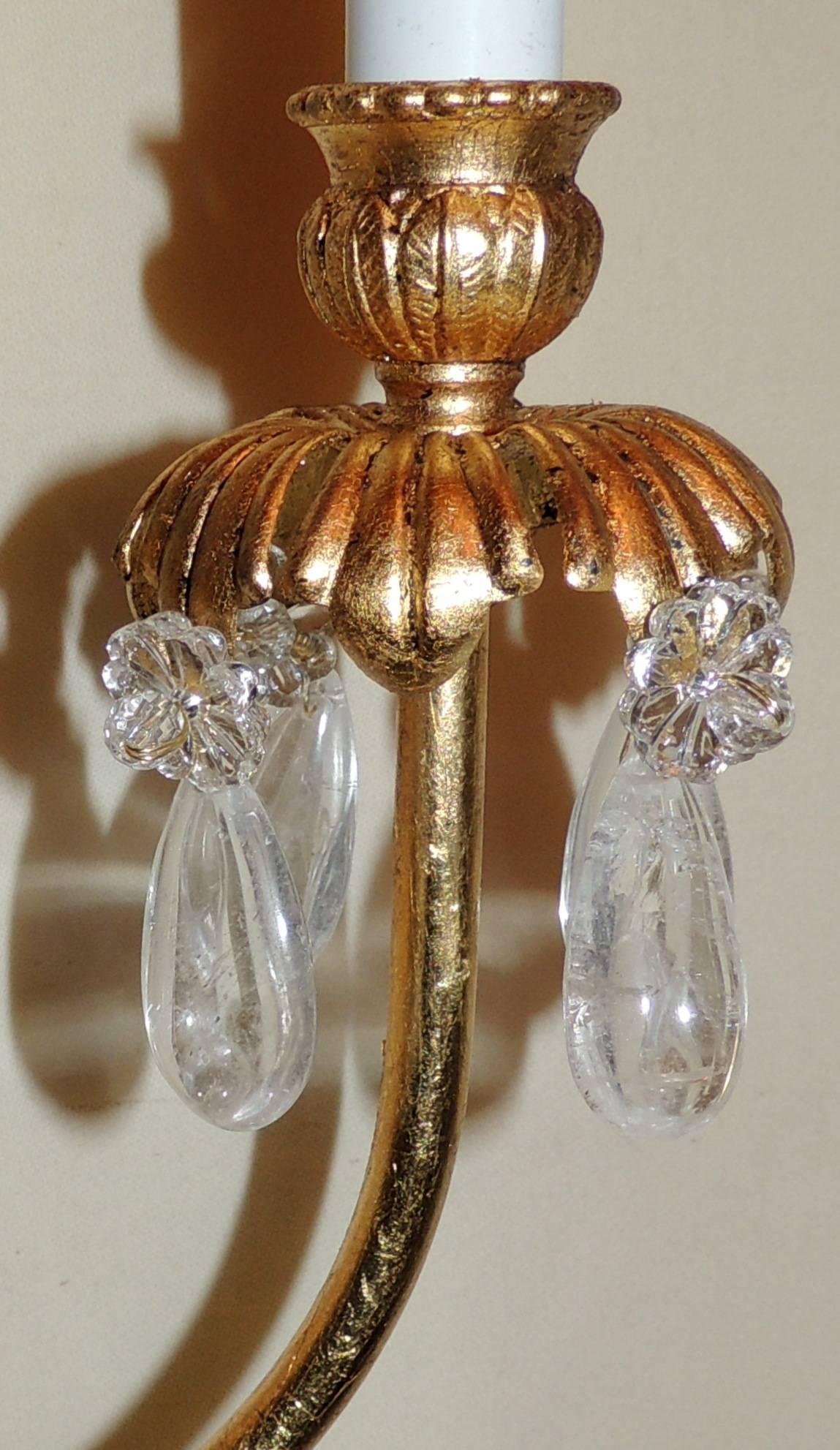 A wonderful pair of Mid-Century Modern star centre medallion and rock crystal gold gilt sconces in the manner of Baguès.
Completely rewired and come ready to install.