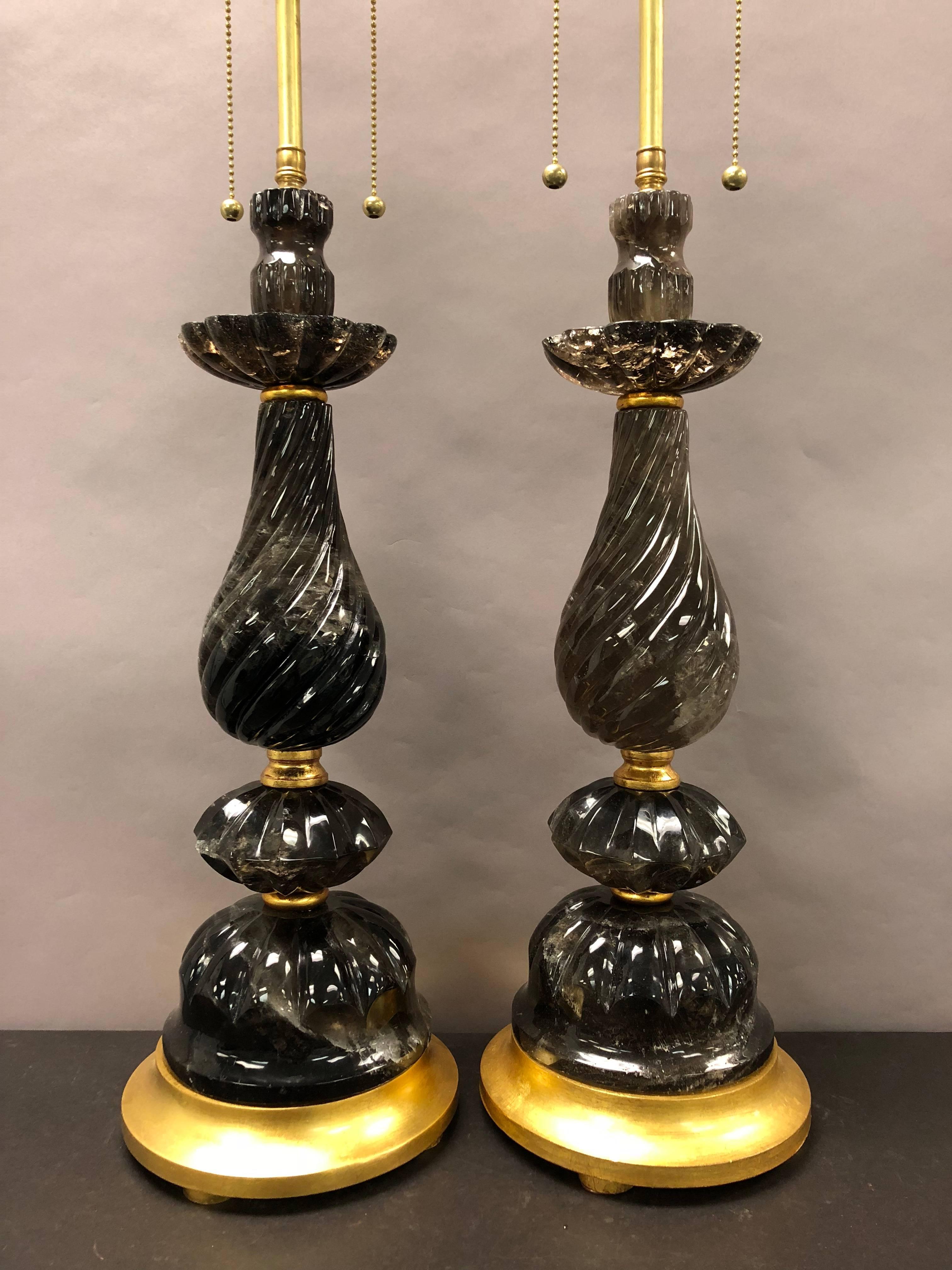 A wonderful pair of Mid-Century Modern, tea color rock crystal or smoke quartz gold giltwood base table lamps.
Measures: H 31” x W 7”.