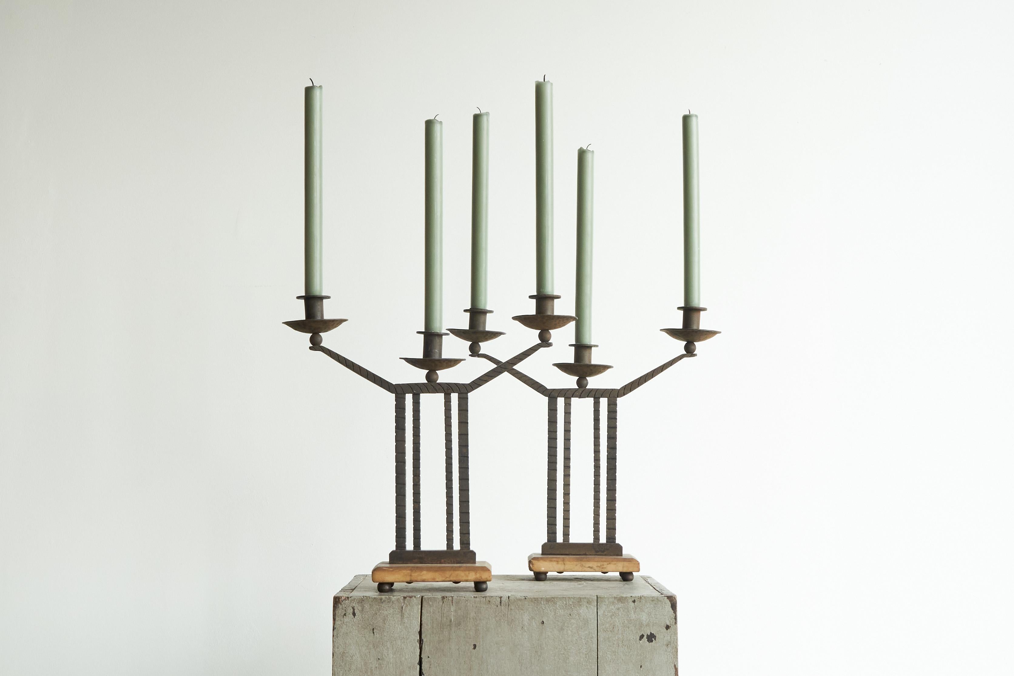 Wonderful Pair of Art Deco Candle Holders in Wrought Iron and Stone, Europe, 1930s.

Hands down the best pair of candle holders we've ever encountered. They feature a very elegant art deco design and show a wonderful hand made quality all over.