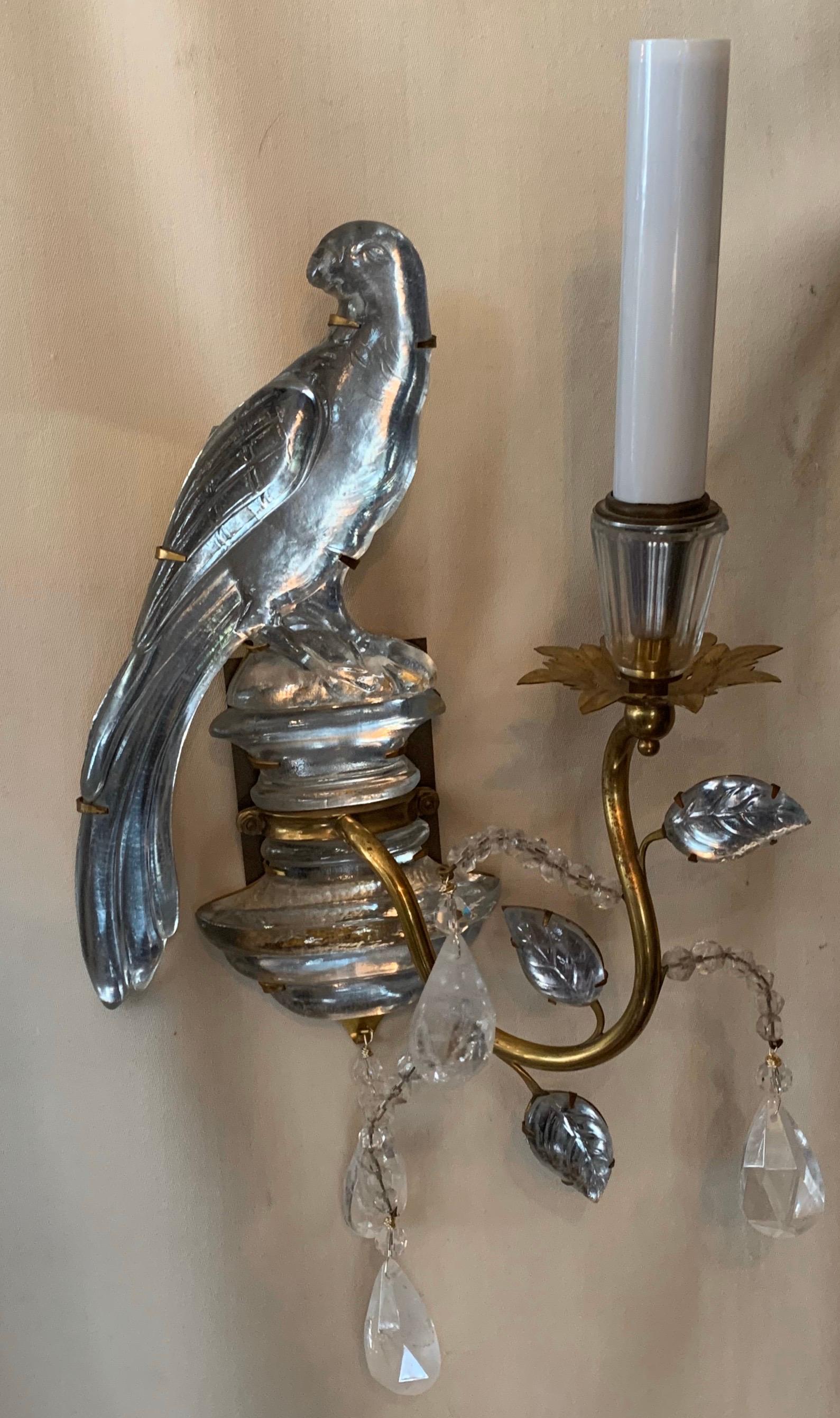 A wonderful pair of Baguès vintage gilt bronze and rock crystal parrot bird sconces.