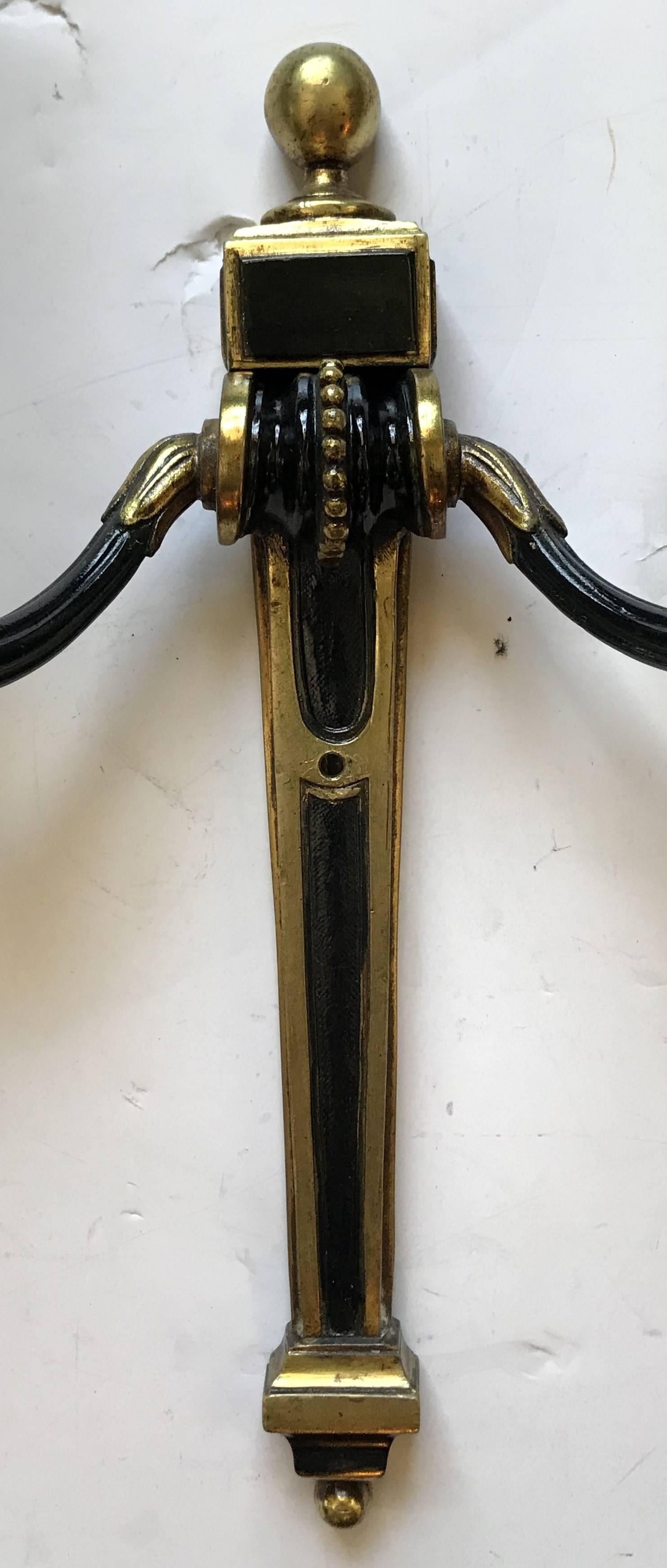 Wonderful pair of Caldwell bronze patinated two-tone classical French style Regency, neoclassical, Empire two-light sconces completely rewired with new candelabra sockets.
 