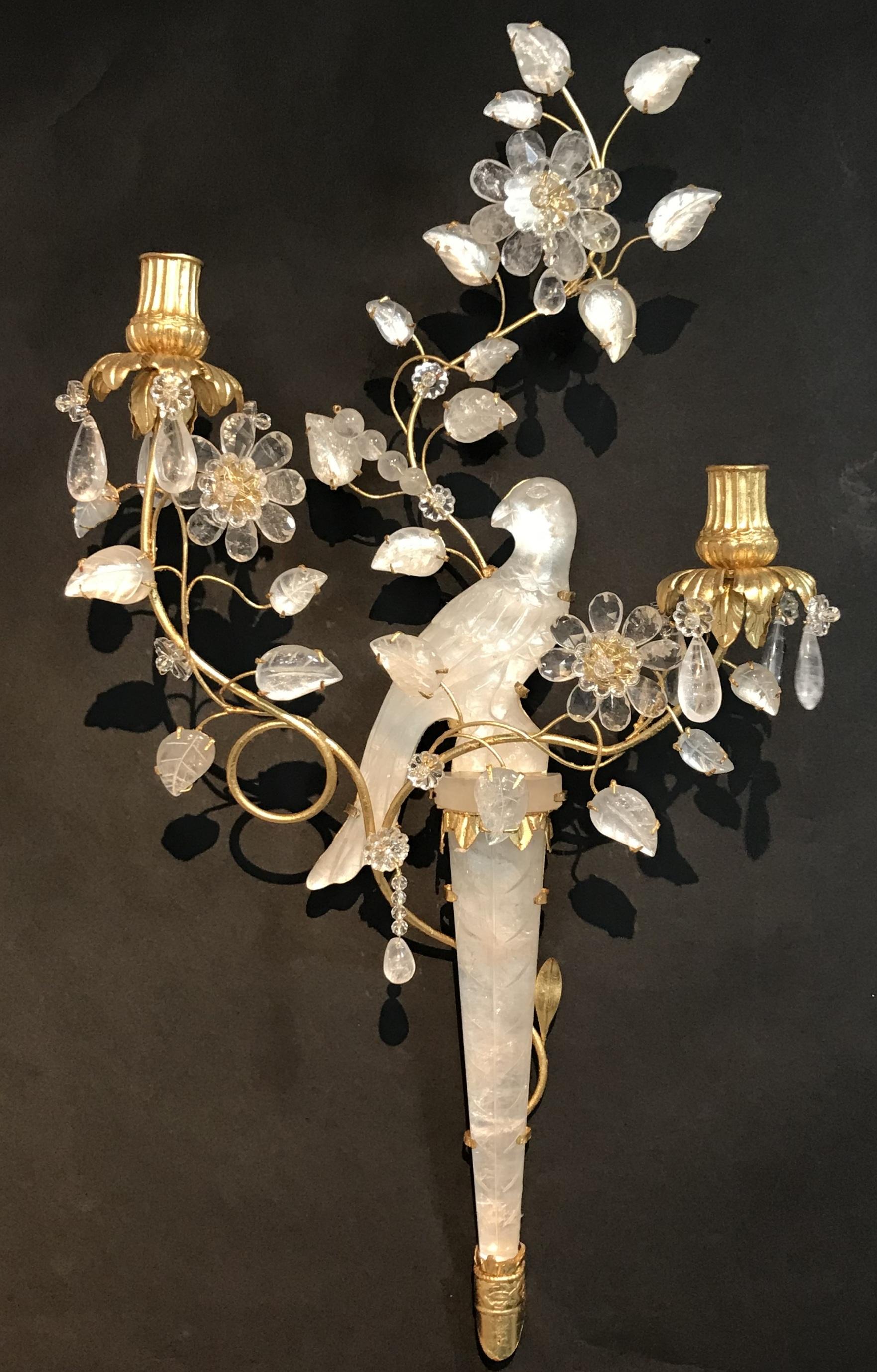 A wonderful pair of chinoiserie style rock crystal two-arm with gold gilt bird and flower form sconces facing one another.

 