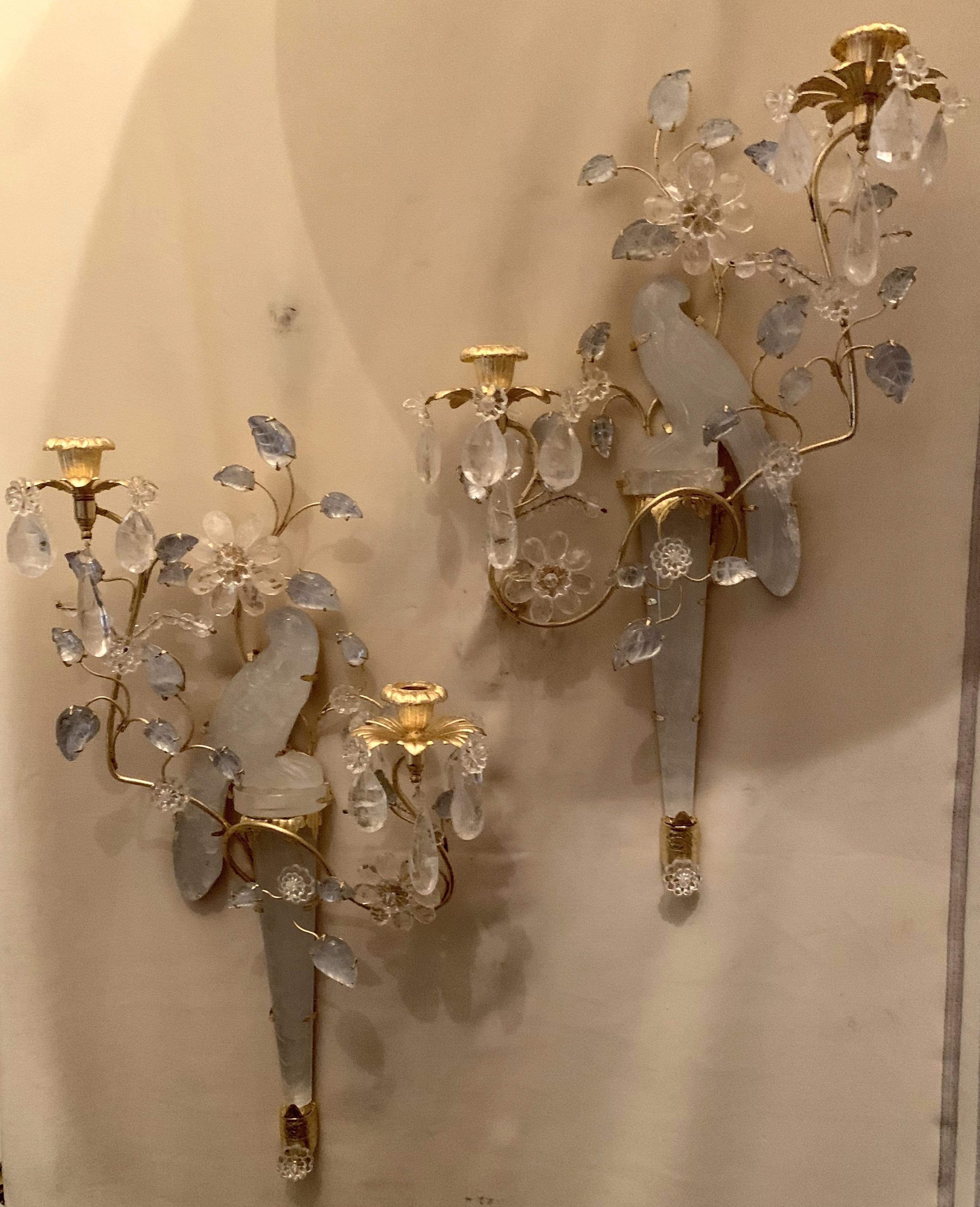 A wonderful pair of chinoiserie style rock crystal two-arm sconces with gold gilt birds facing one another with flowers and leaves throughout, in the manner of Baguès & Sherle Wagner.
Two pairs available
Currently not electrified
$250 to have
