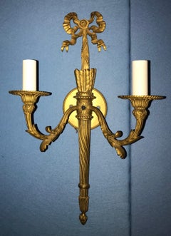 Wonderful Pair of French Doré Bronze Bow Top Flame Two-Light Filigree Sconces