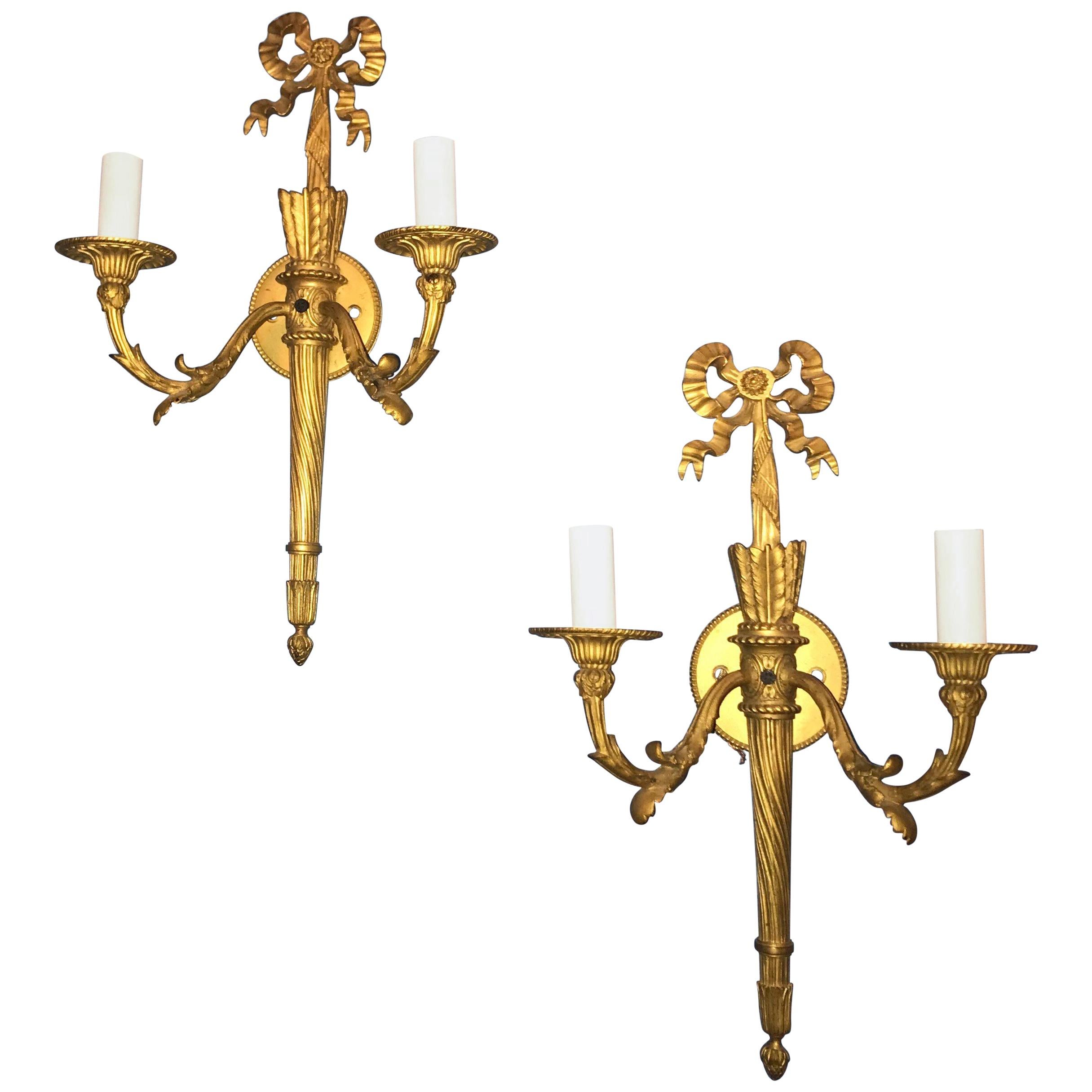 Wonderful Pair of French Doré Bronze Bow Top Flame Two-Light Filigree Sconces For Sale