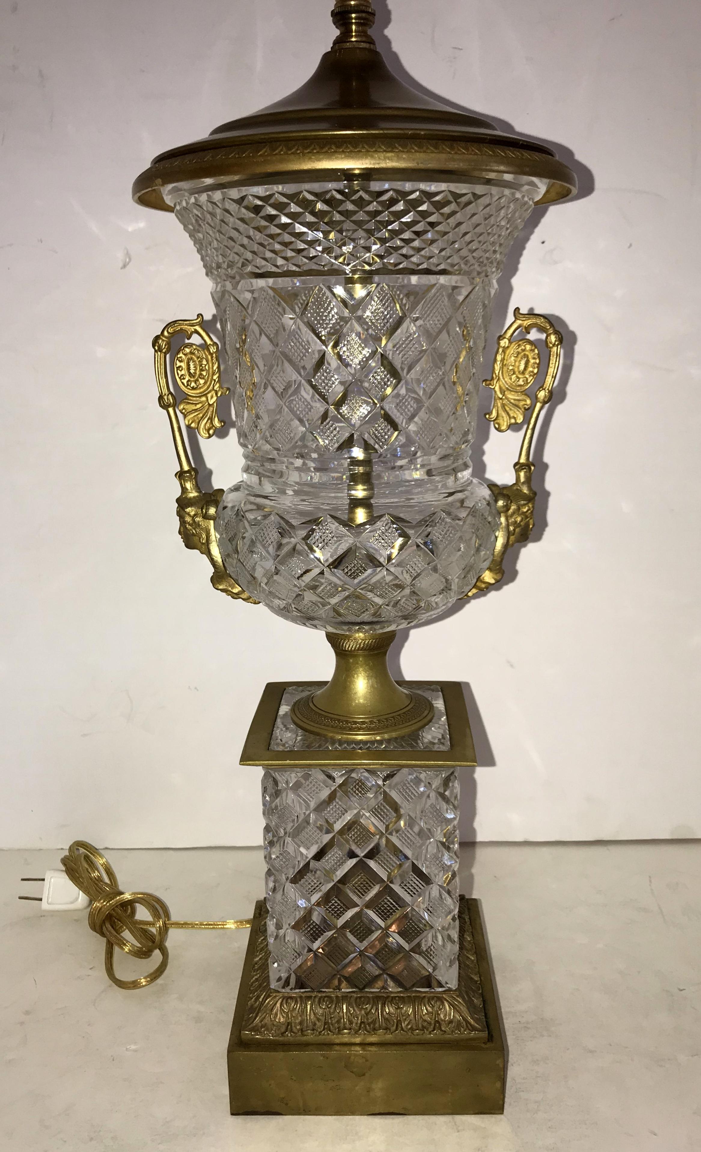 A wonderful pair of French Empire / neoclassical cut crystal and gilt doré bronze ormolu-mounted urn form lamps, completely rewired with two Edison sockets each.
Height is adjustable.