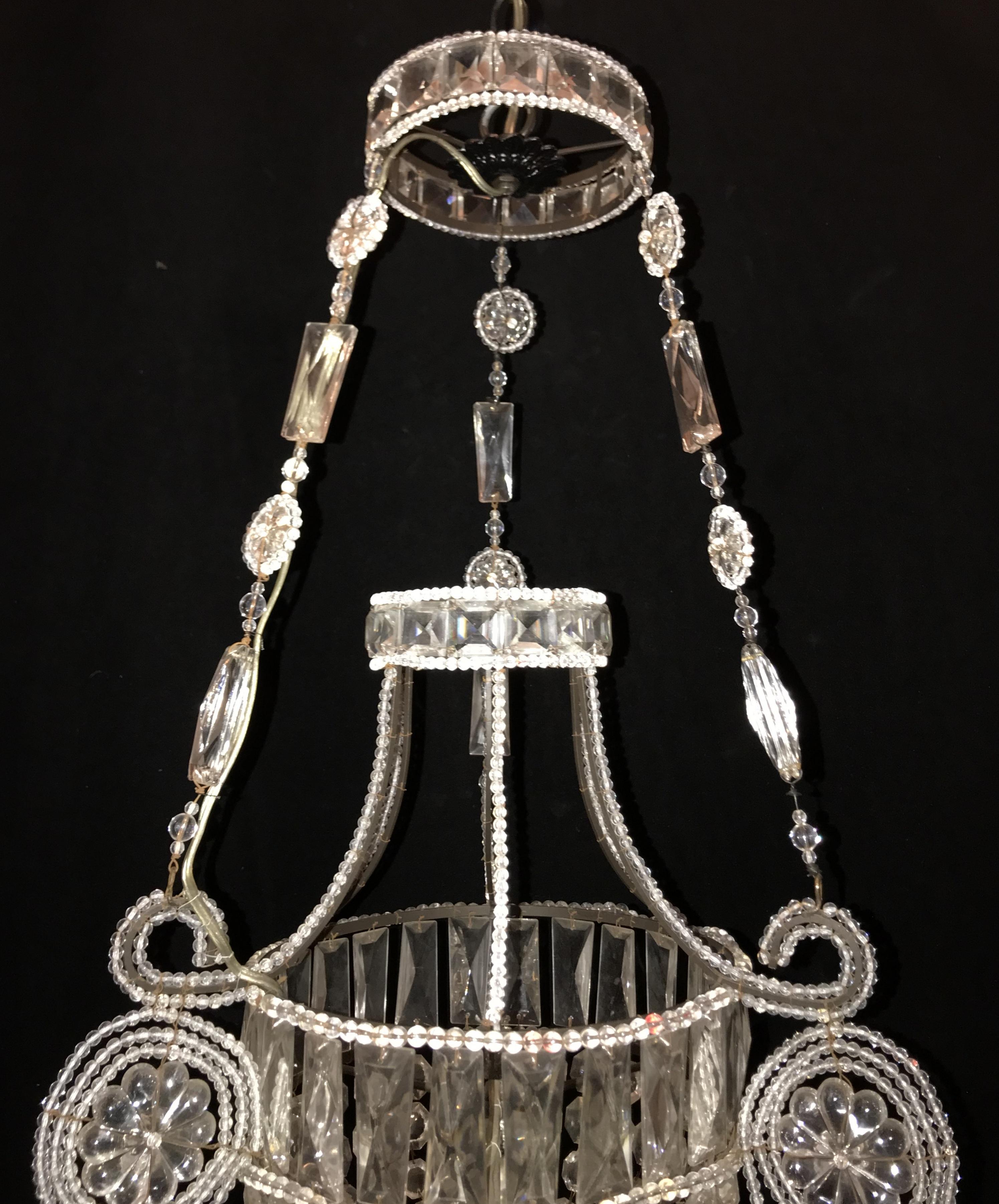 A wonderful pair of Italian beaded crystal / glass basket / urn form pendent chandeliers / fixtures with single Edison bulbs each.
The height is adjustable to your needs.
Two available,
Sold separately.