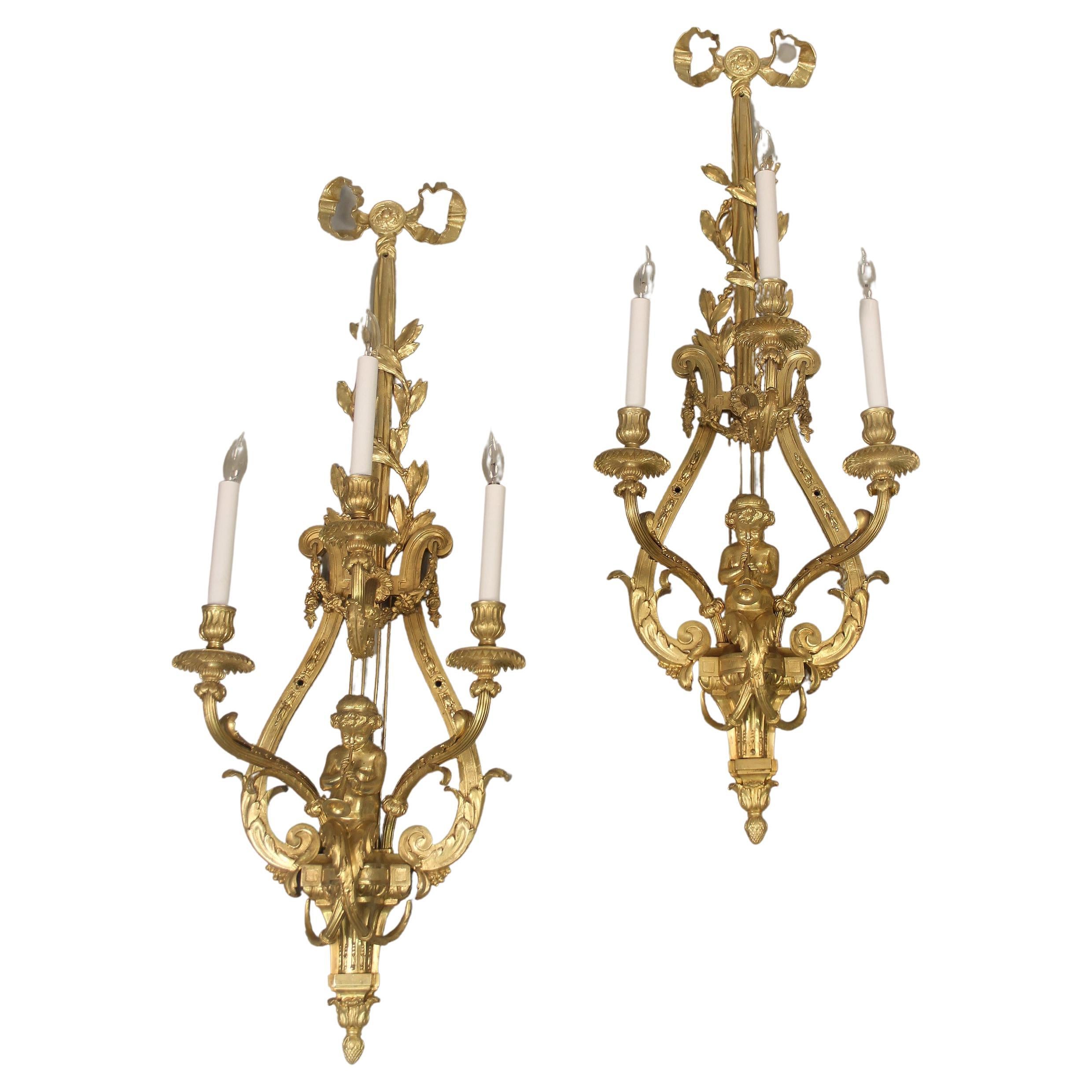 Wonderful Pair of Late 19th Century Gilt Bronze Three Light Cherub Sconces