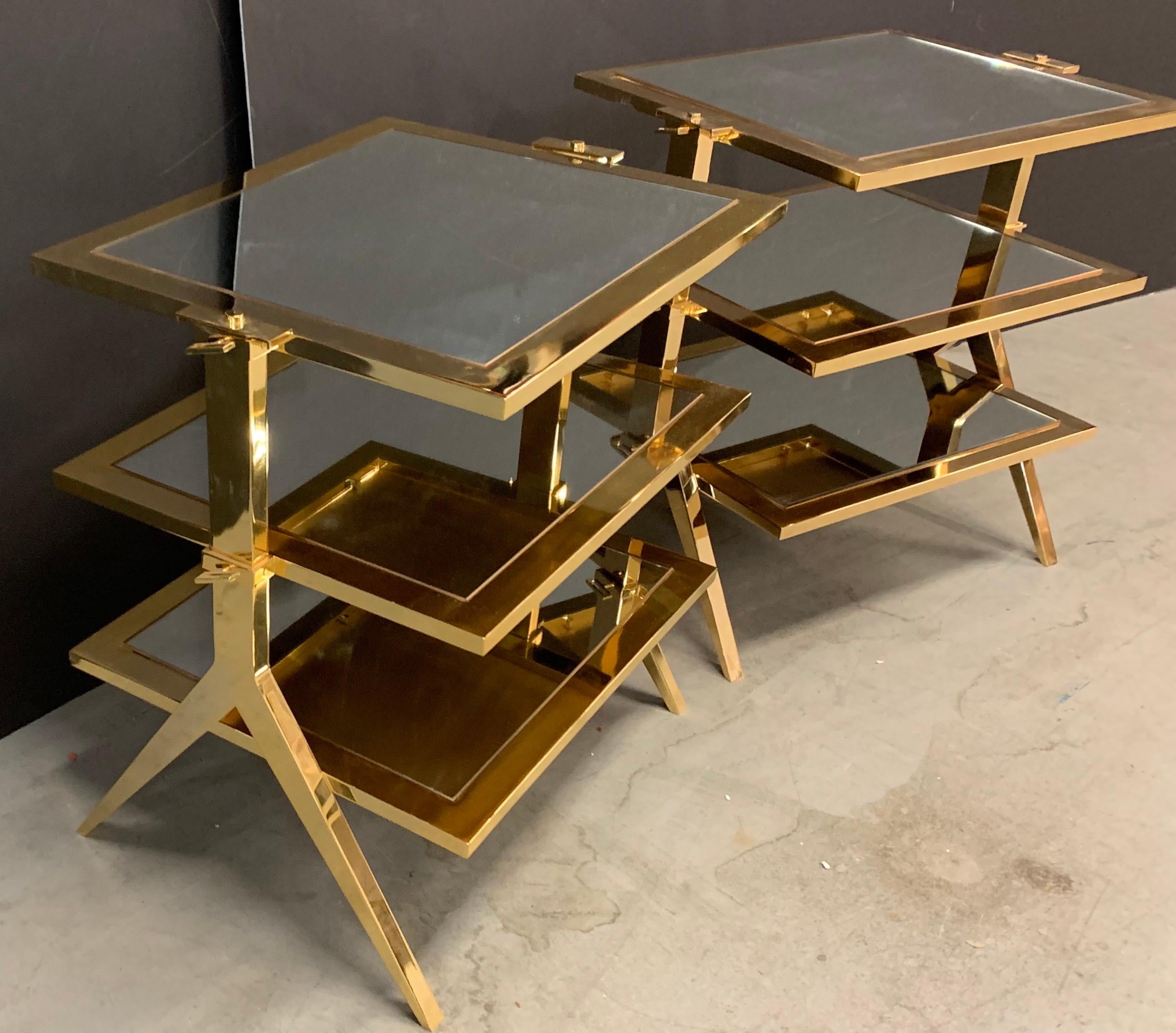 A wonderful pair of Lorin Marsh polished brass and mirror three-tier side tables

Each sold separately

Measurements:
28.5