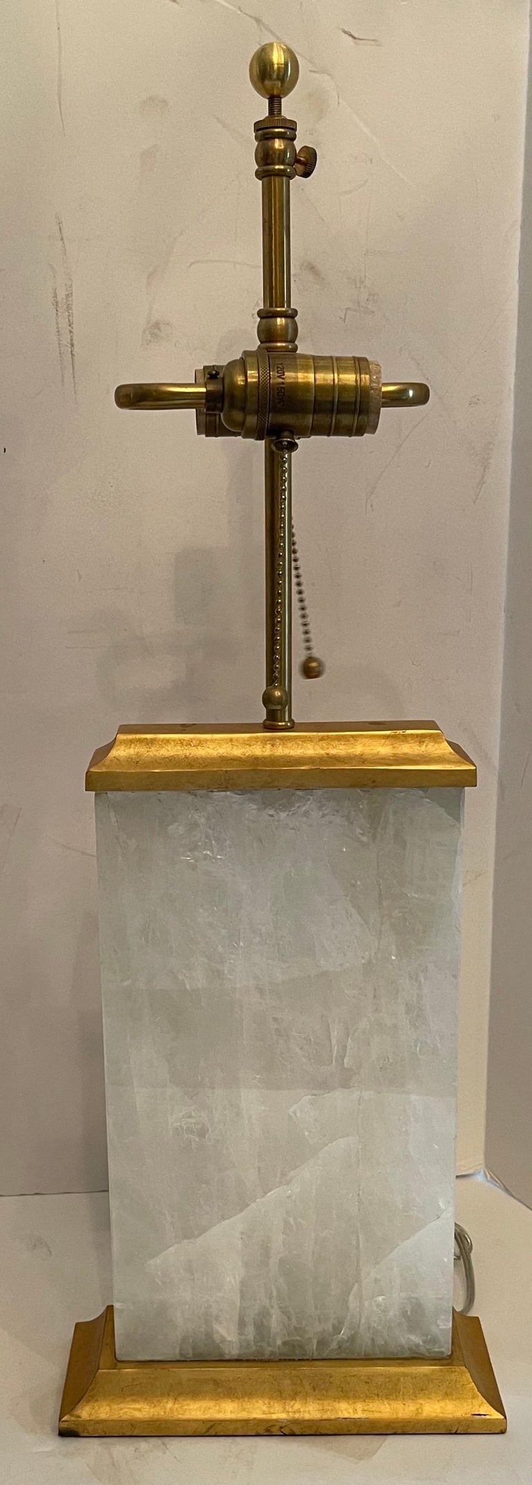 A wonderful pair of modern block form rock crystal / quartz and gilt metal lamps
Rewired with new sockets
Height is adjustable.