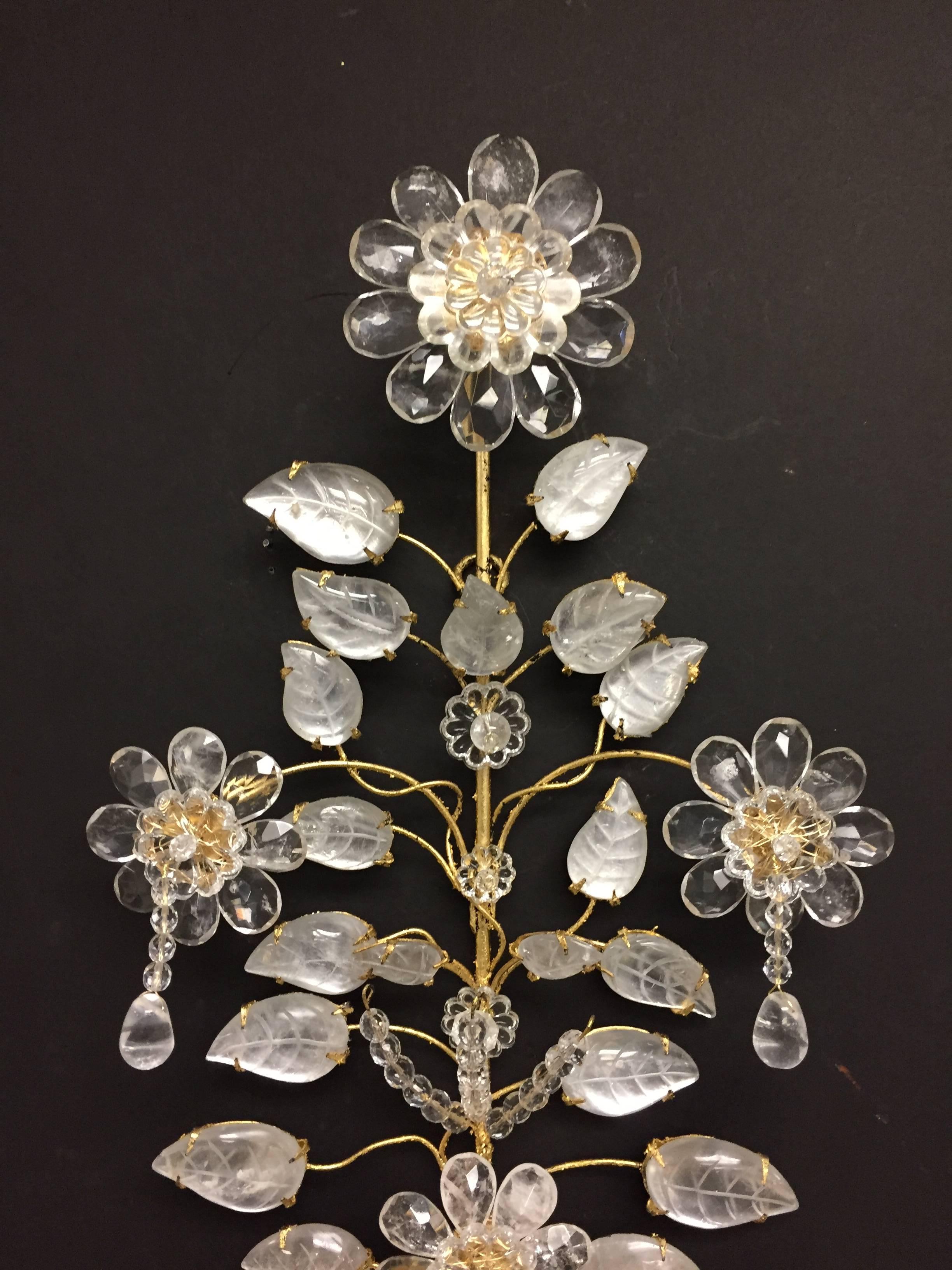 A wonderful pair of rock crystal and gold gilt, Baguès / Jansen style two arm Mid-Century Modern sconces.
Wiring is available for an additional charge of $250 for the pair

Measures: H 29.5” X W 13” X D 5.5”.